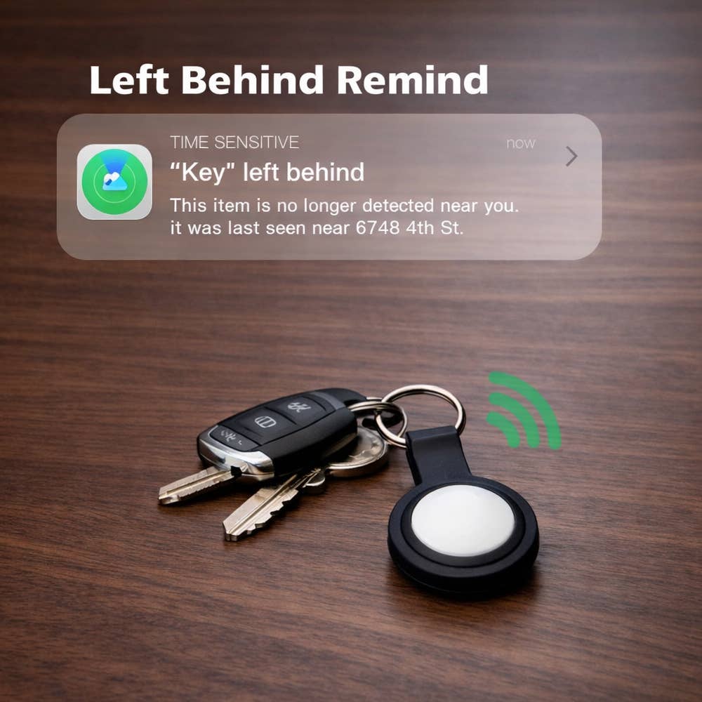 Keychain with a device displaying 'Left Behind Remind' on a wooden surface