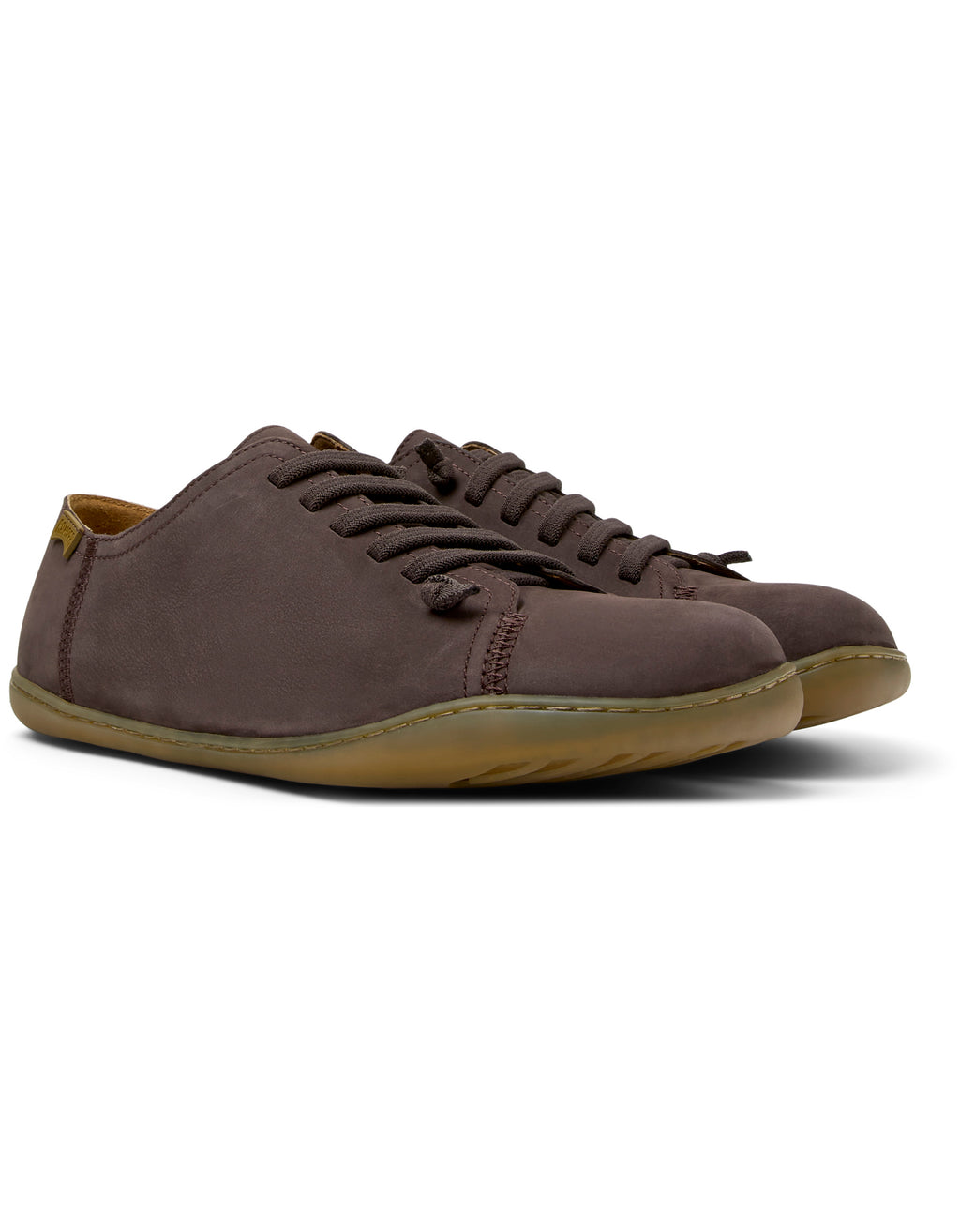 Brown suede shoes on a white background