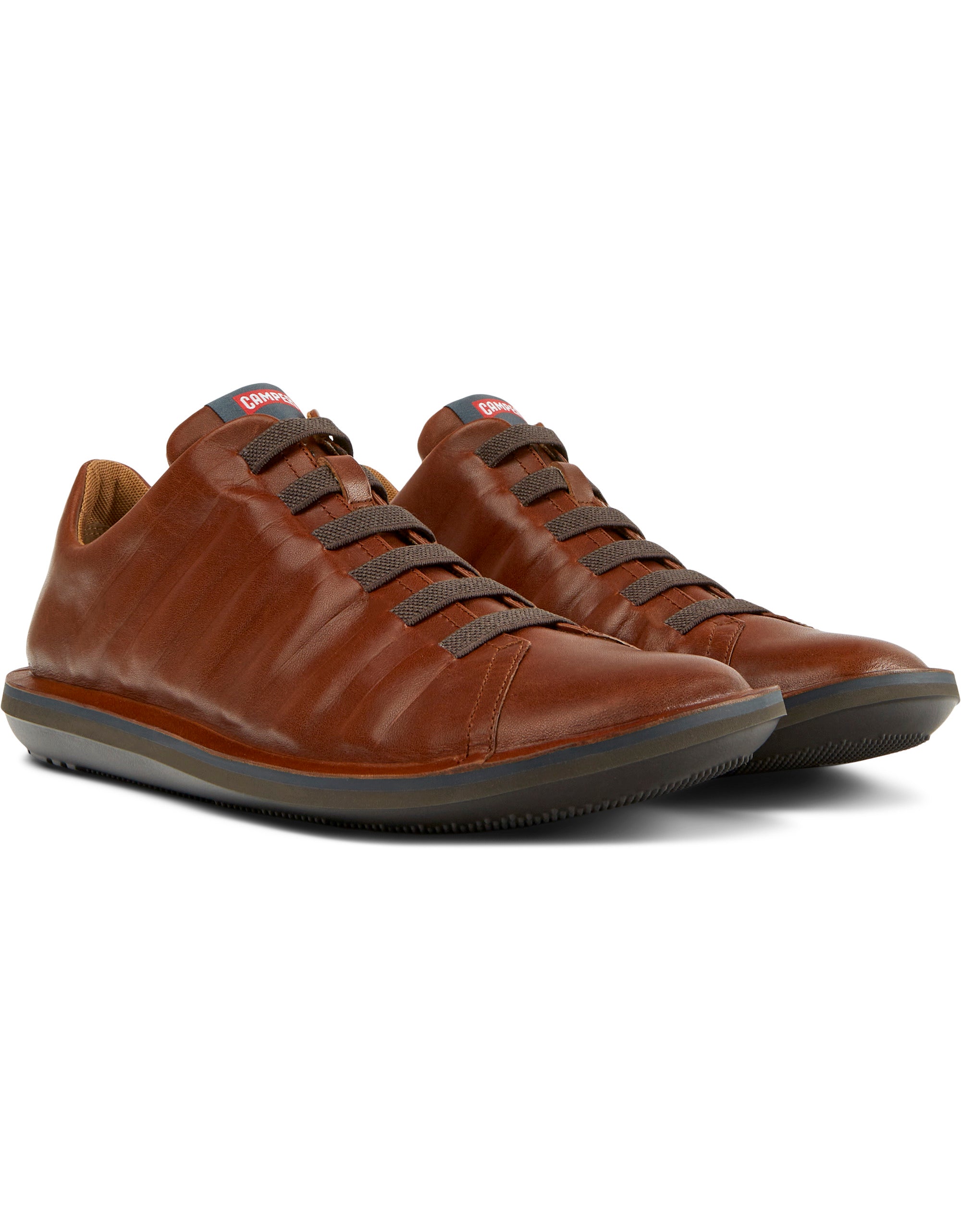 Pair of brown leather shoes on a white background