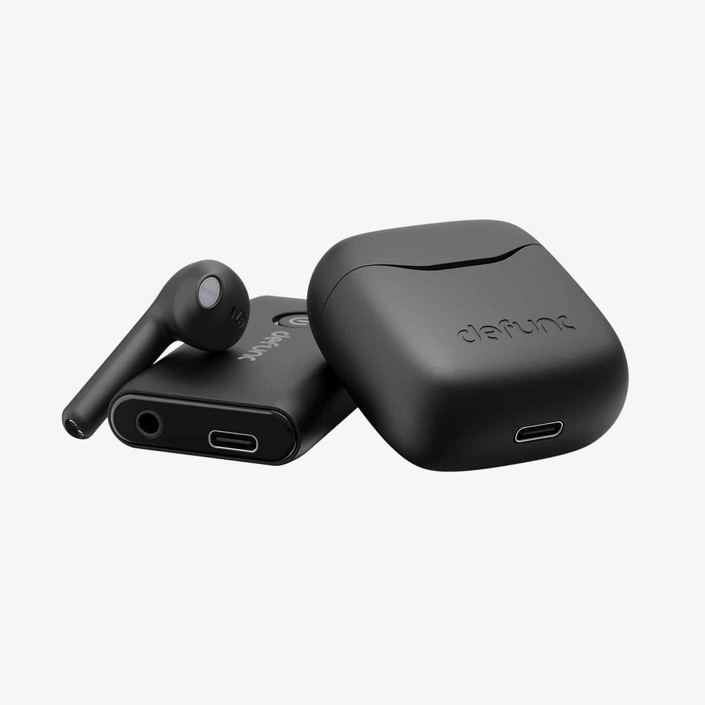 Defunc True Travel Bluetooth earbuds on white background