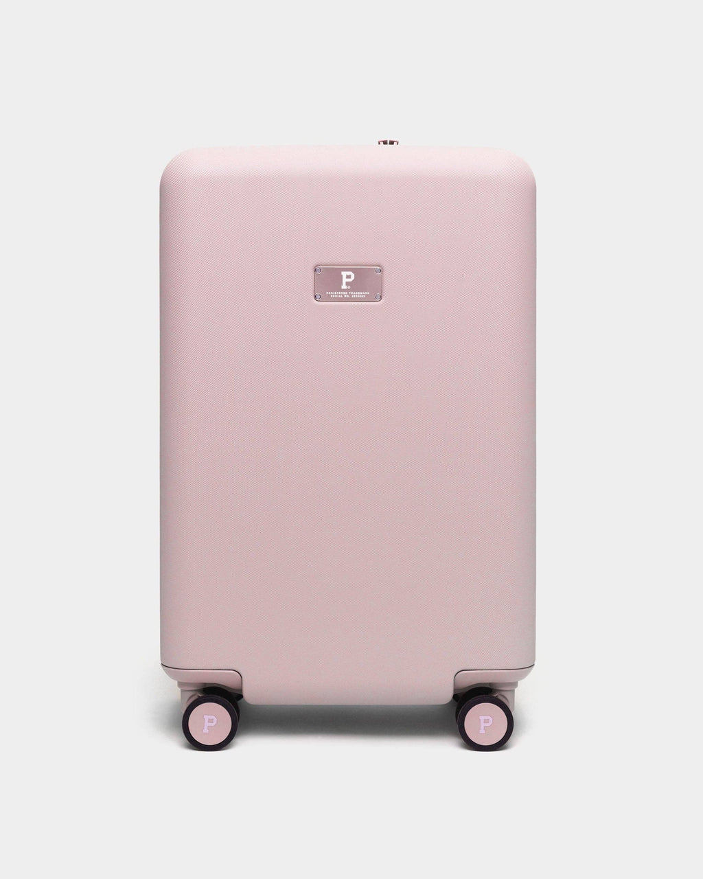 Pink suitcase with a visible brand logo on a white background