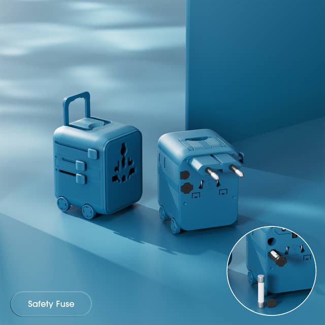 Two blue travel adapters on a blue surface with a close-up of a safety fuse.