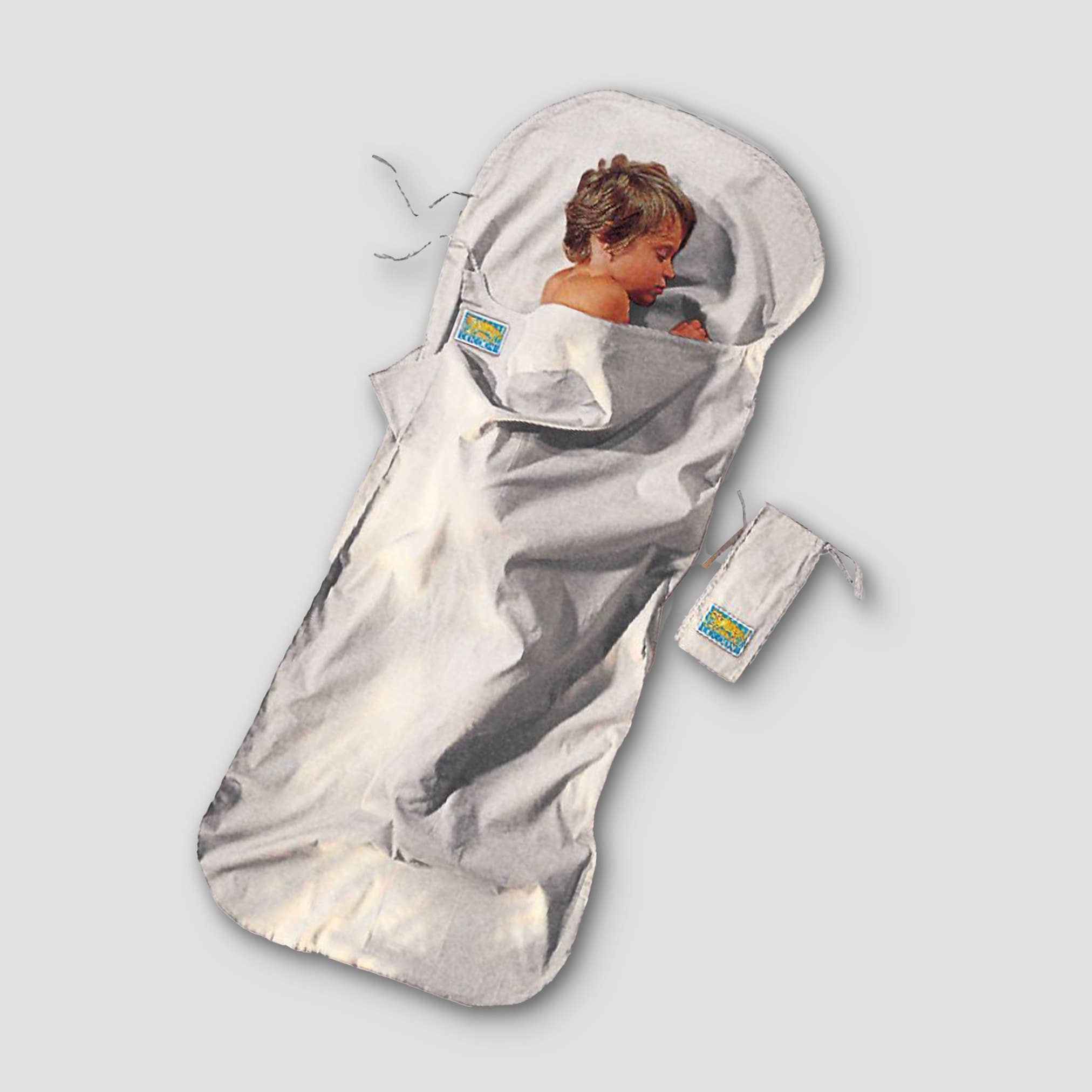 Kids sleeping bag with a child inside on a light gray background