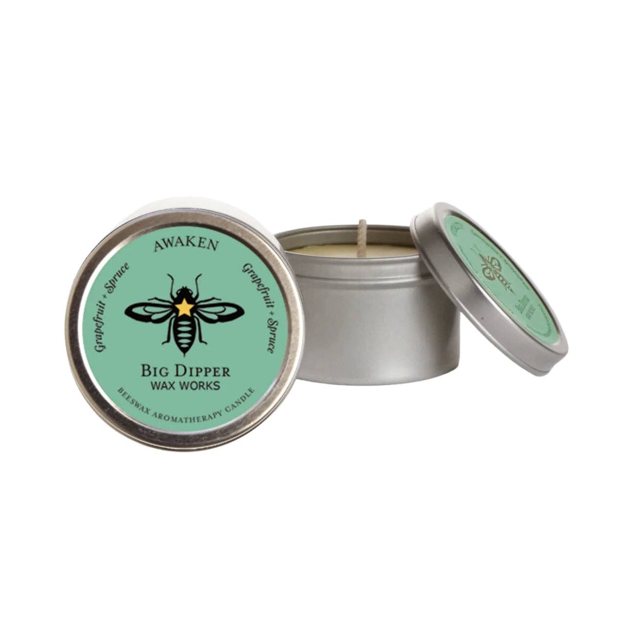 Awaken Candle in a metal tin with a green label featuring a bee design, on a white background.