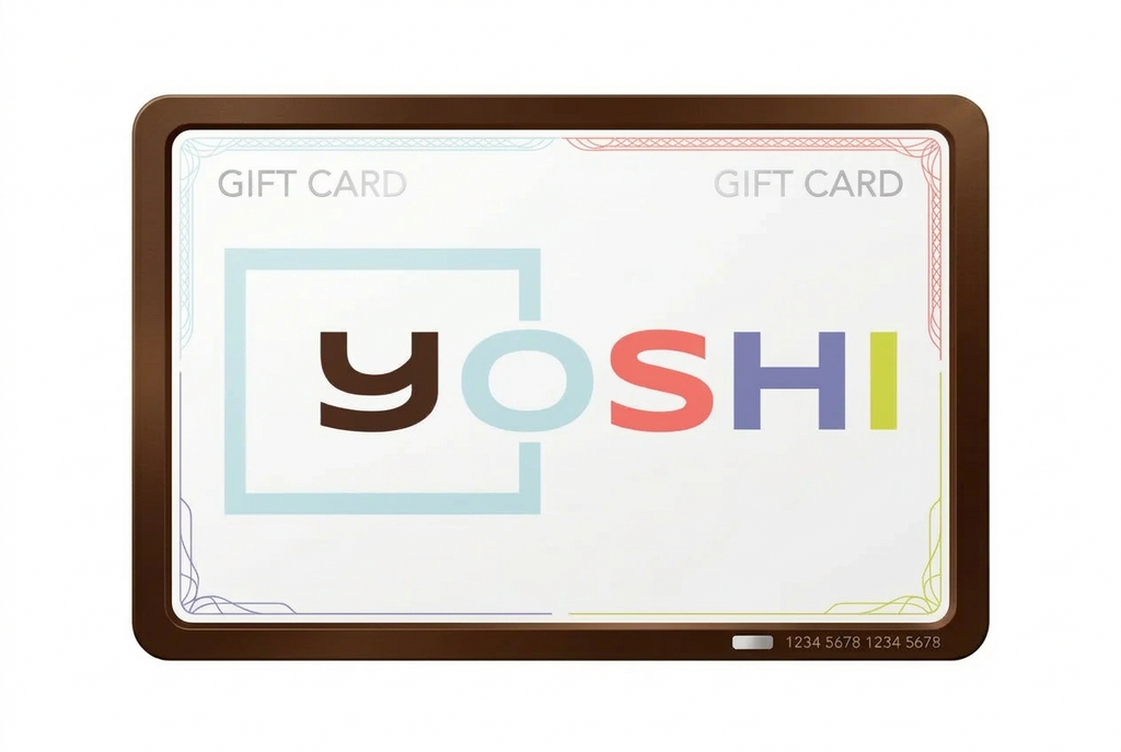 A rectangular gift card with rounded corners, featuring a brown border and a white face. The card displays the word 'yoshi' in large multicolored letters with a light blue square outline behind the 'y'.