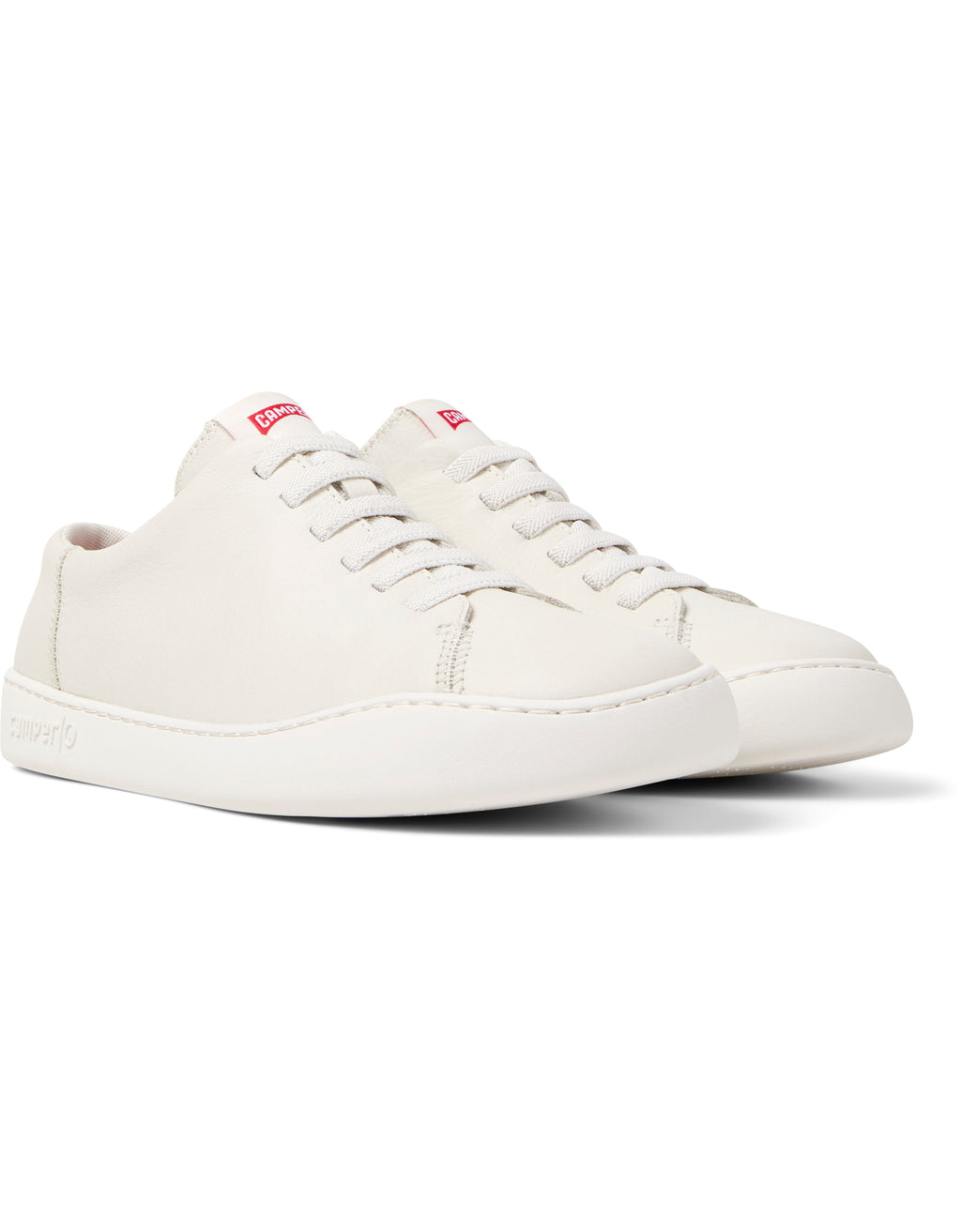 White sneaker with red logo on a white background