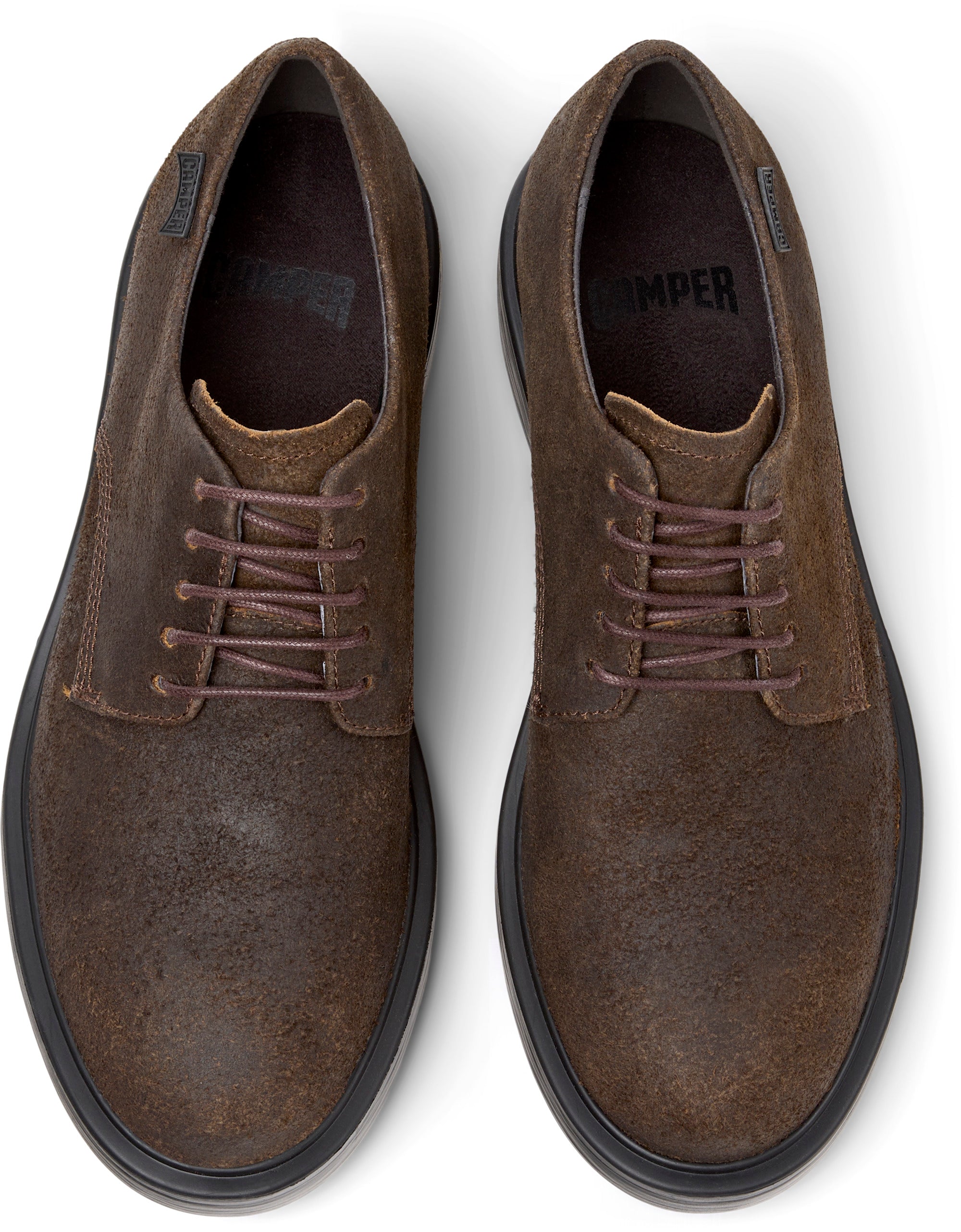 Pair of brown suede shoes on a white background