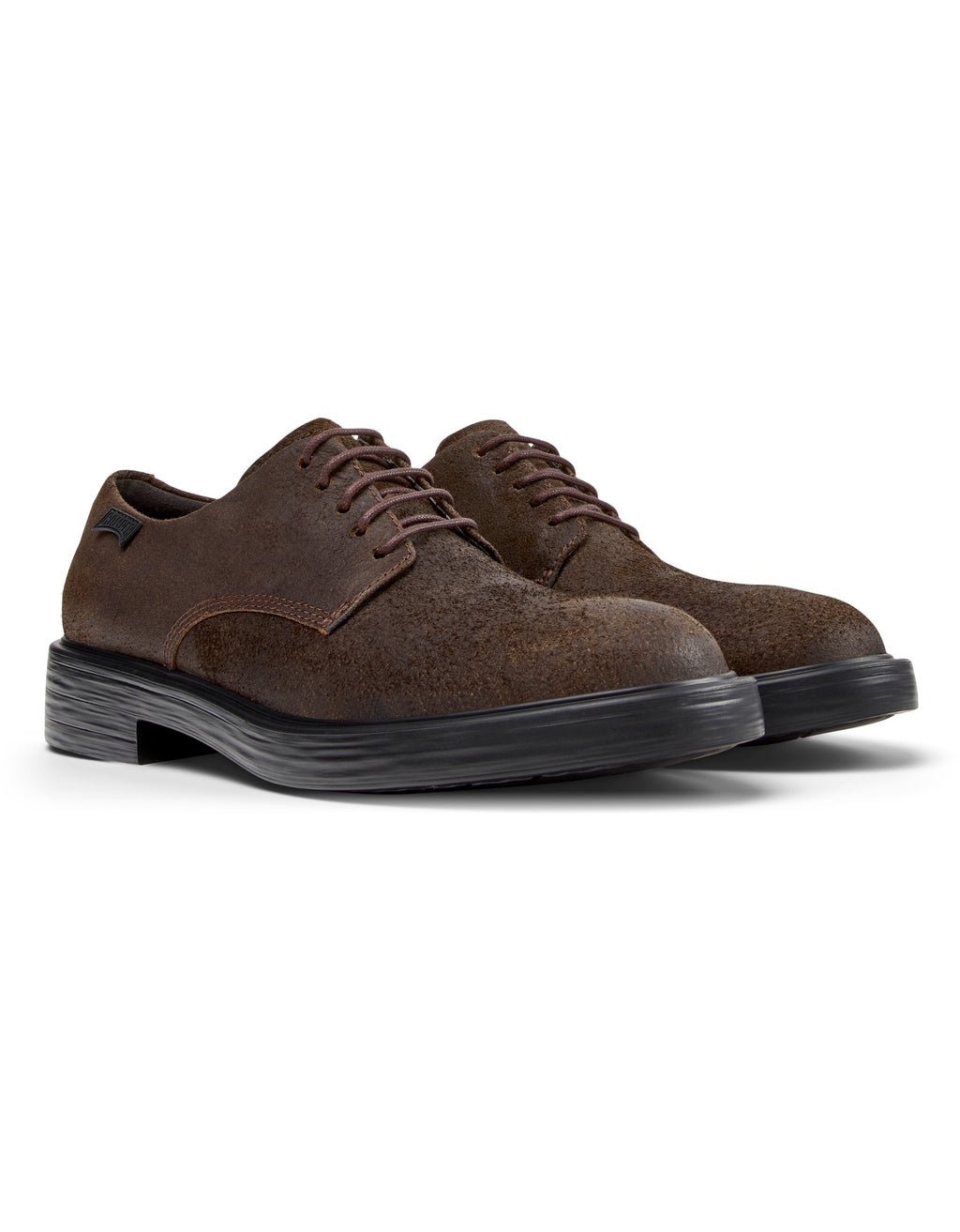 Pair of brown suede shoes on a white background