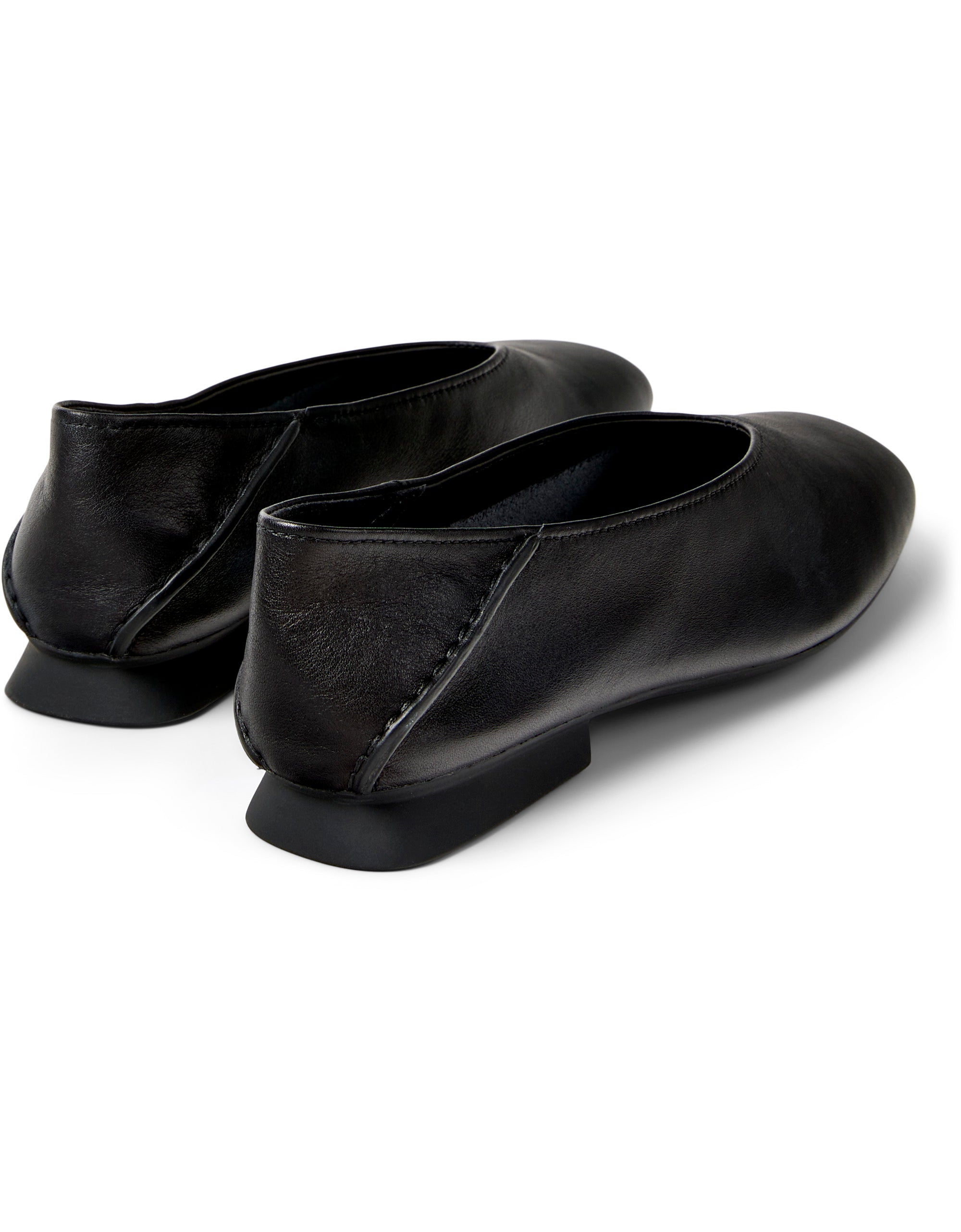 Pair of black leather shoes on a white background