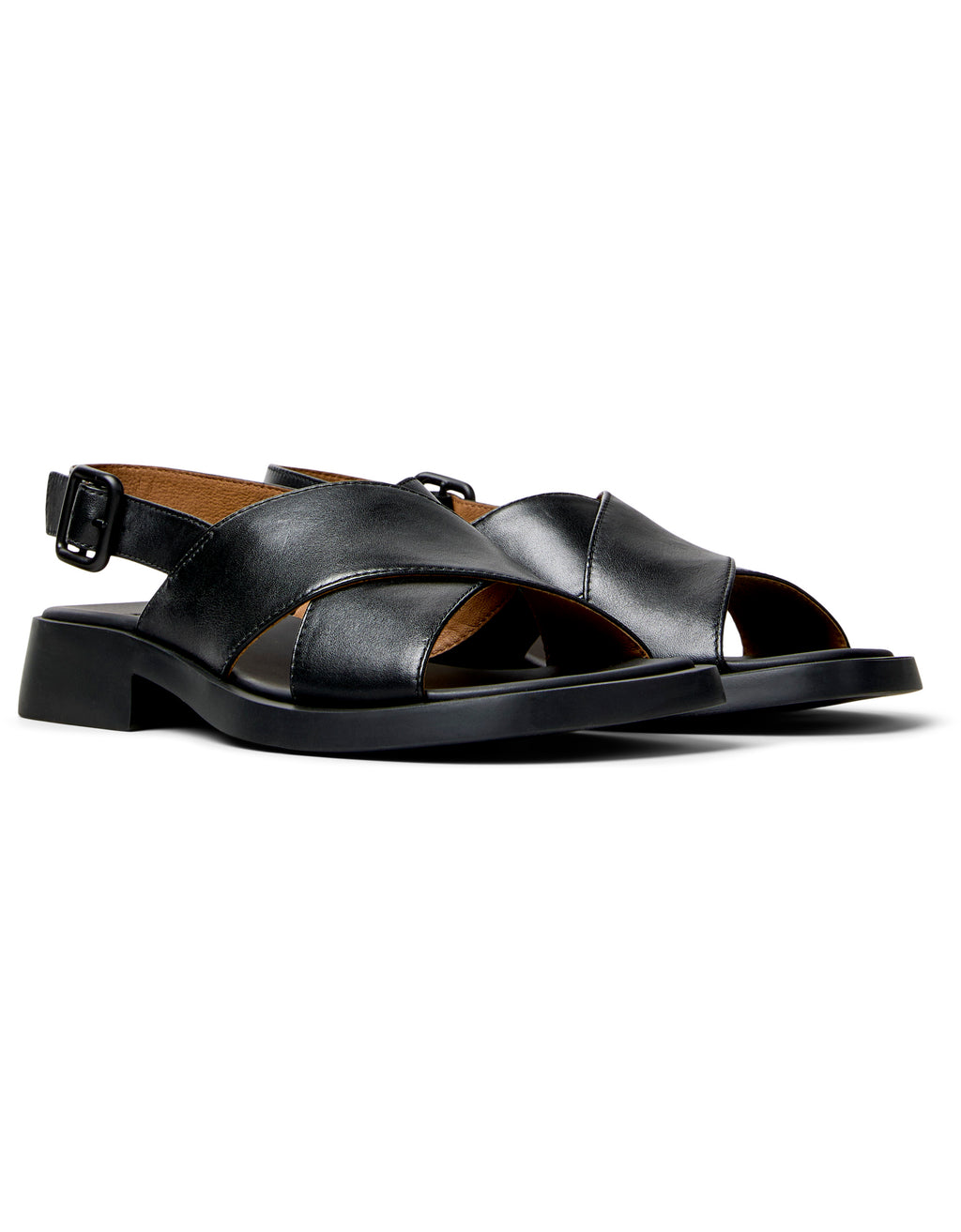 Black sandal with a block heel on a white background