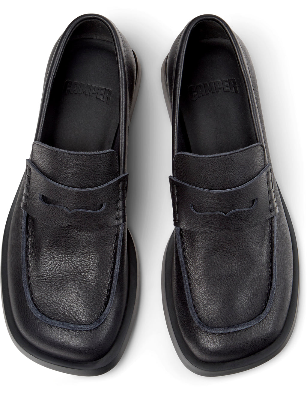 Black loafers on a white background