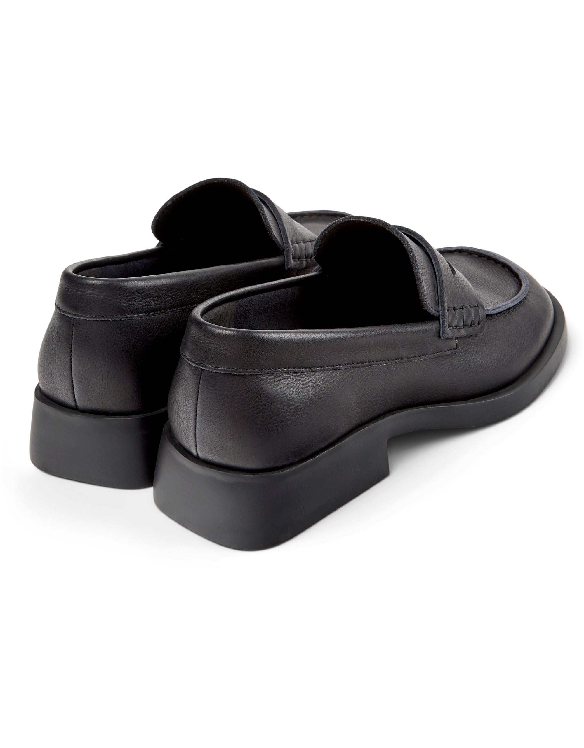 Pair of black shoes on a white background