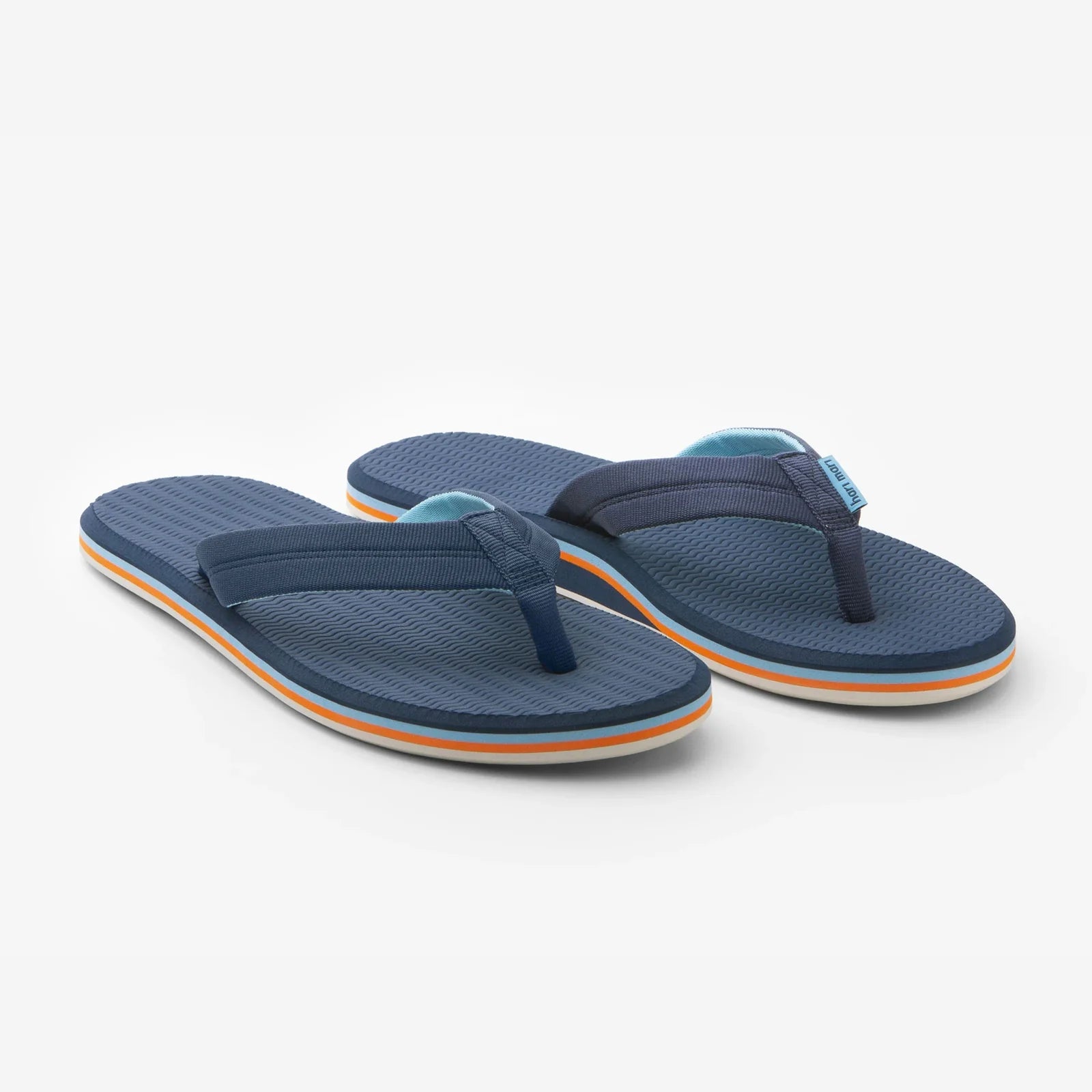 Pair of blue flip-flops with orange accents on a white background