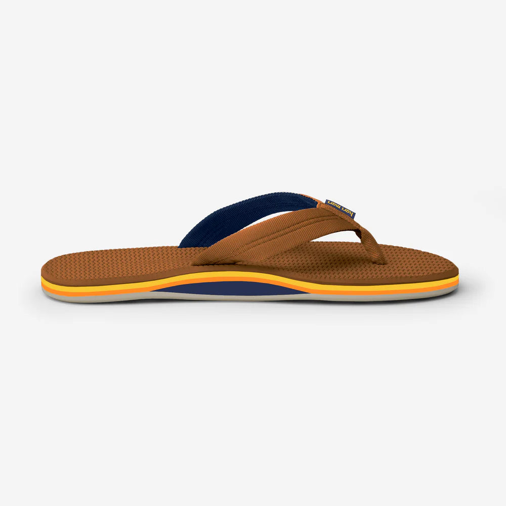 Brown sandal with blue and orange accents on a white background