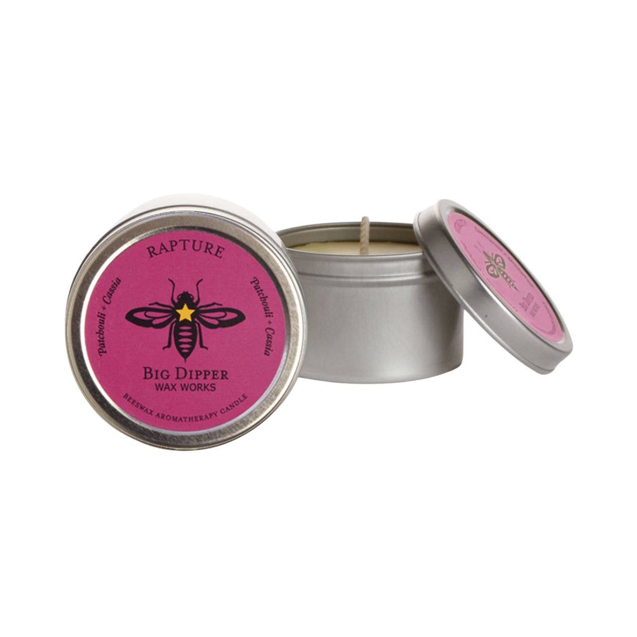 Rapture Candle in a metal tin with a pink lid featuring a logo, on a white background