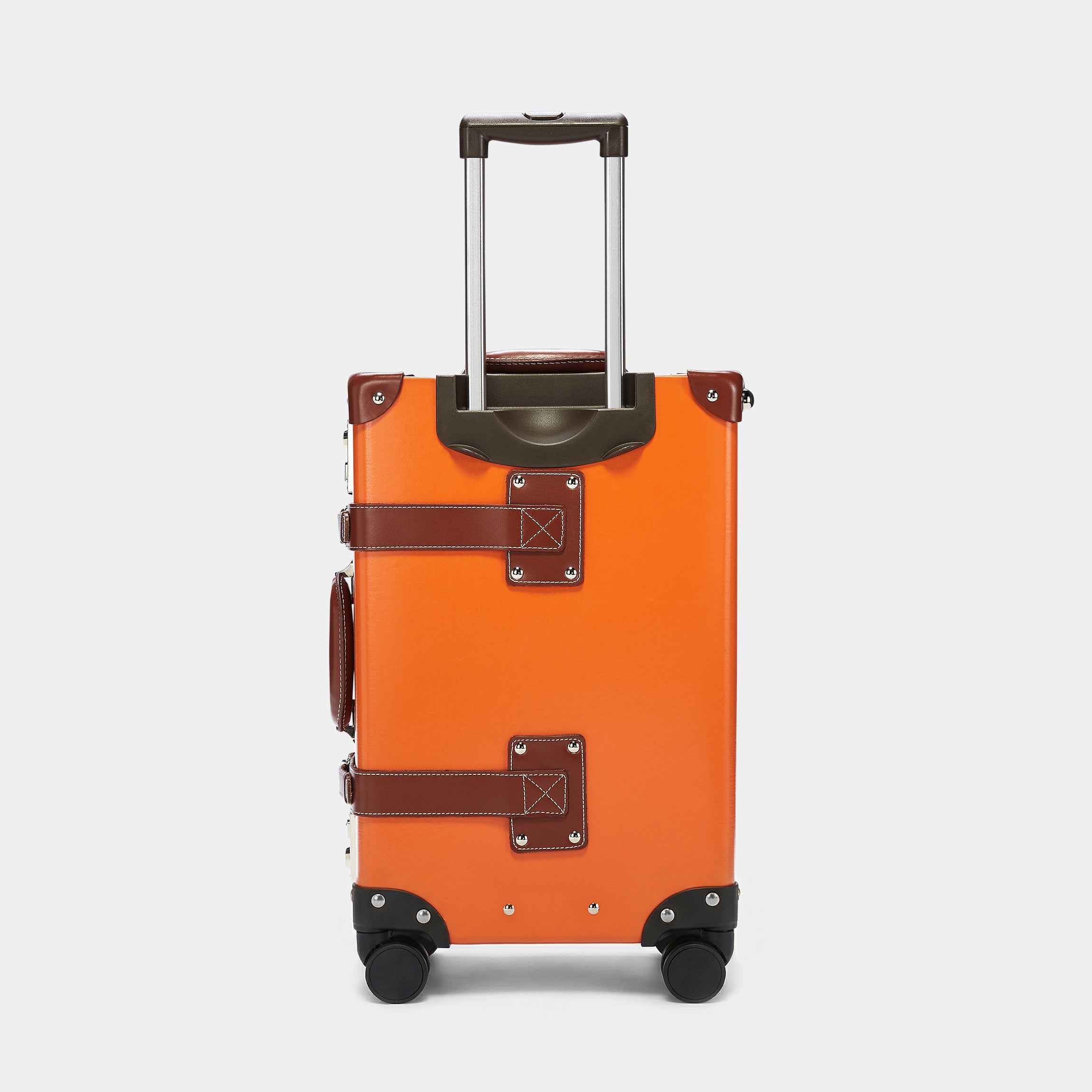 Orange suitcase with brown accents on a light gray background