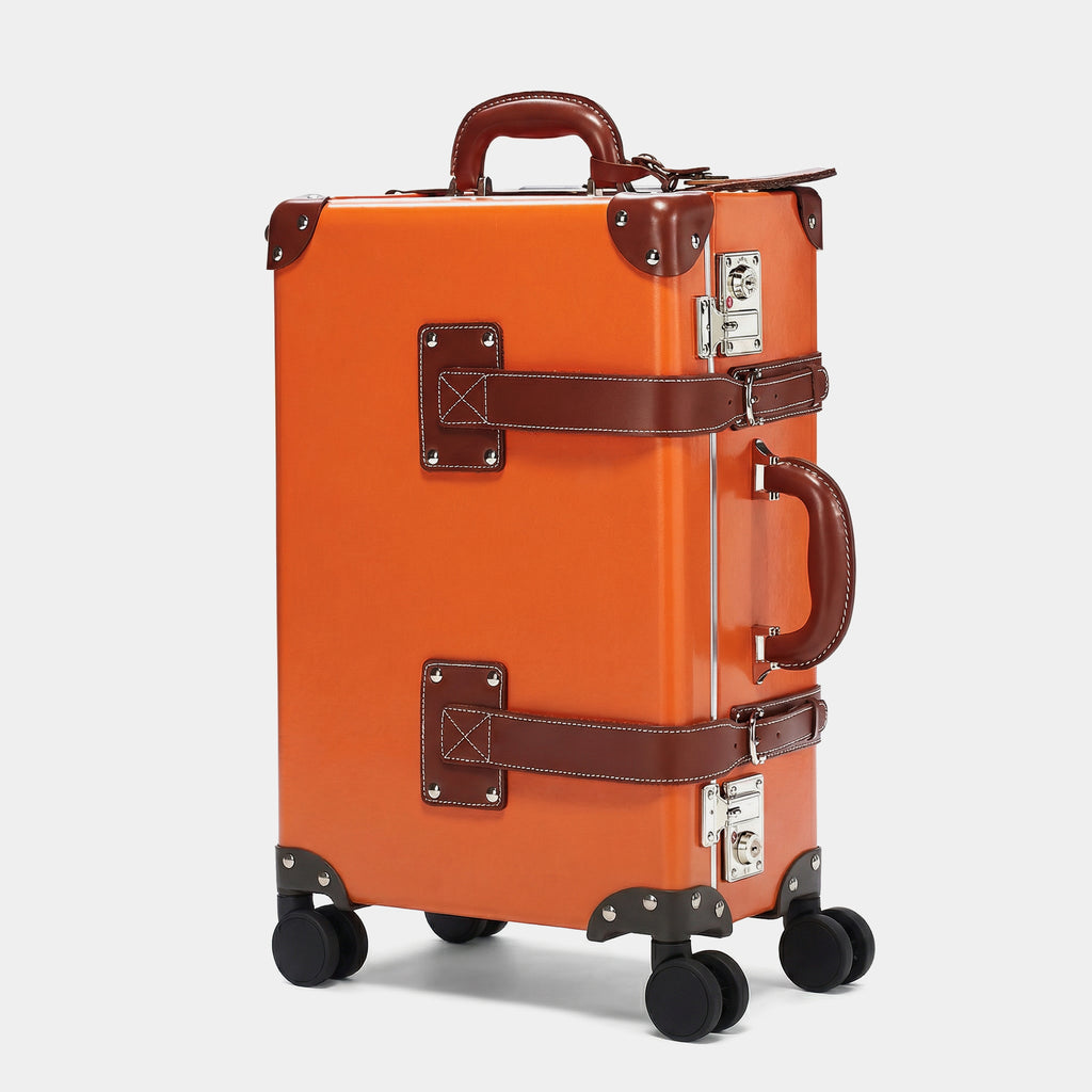 Orange suitcase with brown accents on a white background