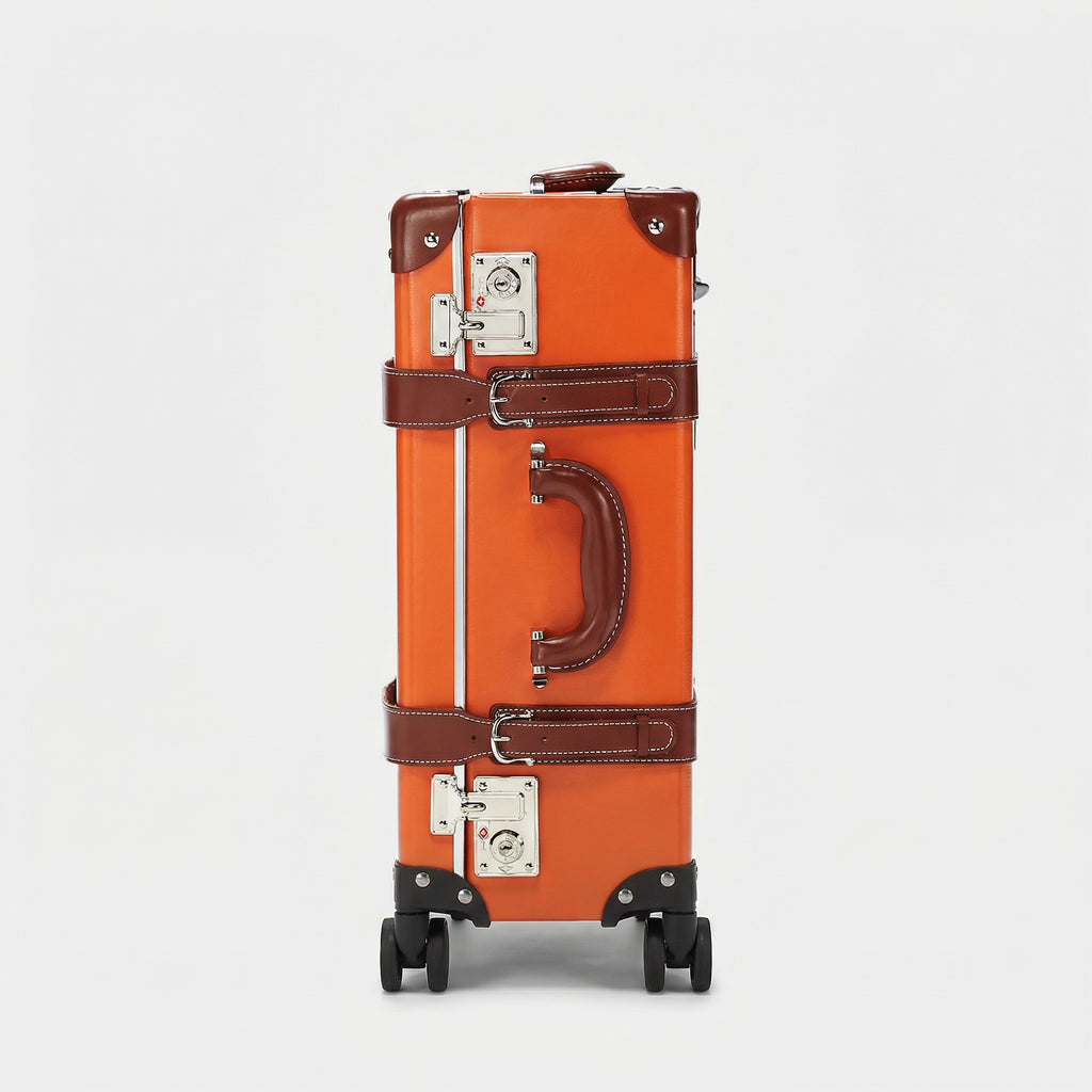 Orange suitcase with brown accents on a light gray background