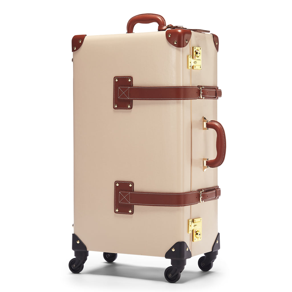 Beige suitcase with brown accents on a white background