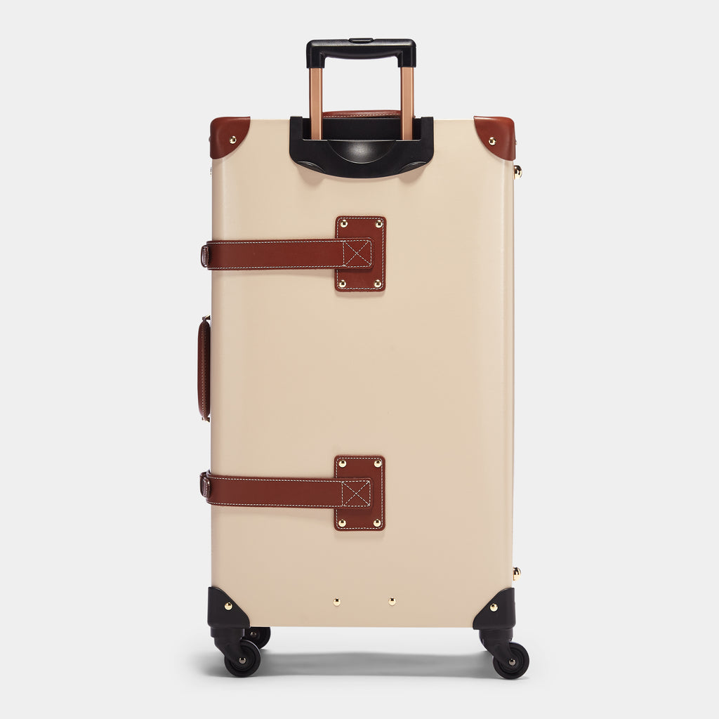 Beige suitcase with brown accents on a light gray background
