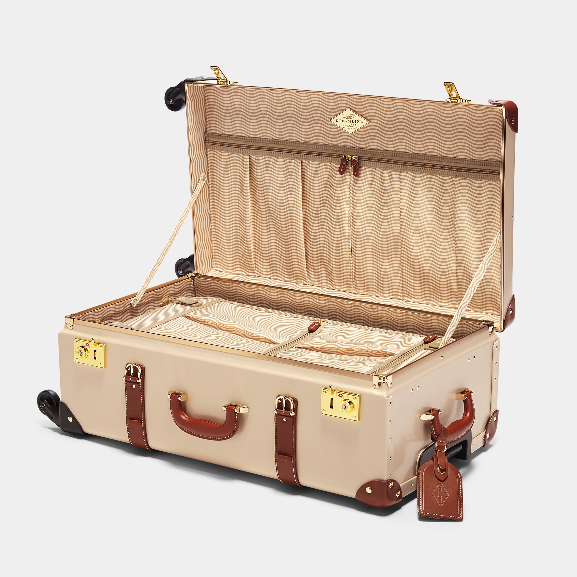 Beige suitcase with open lid on a light gray background
