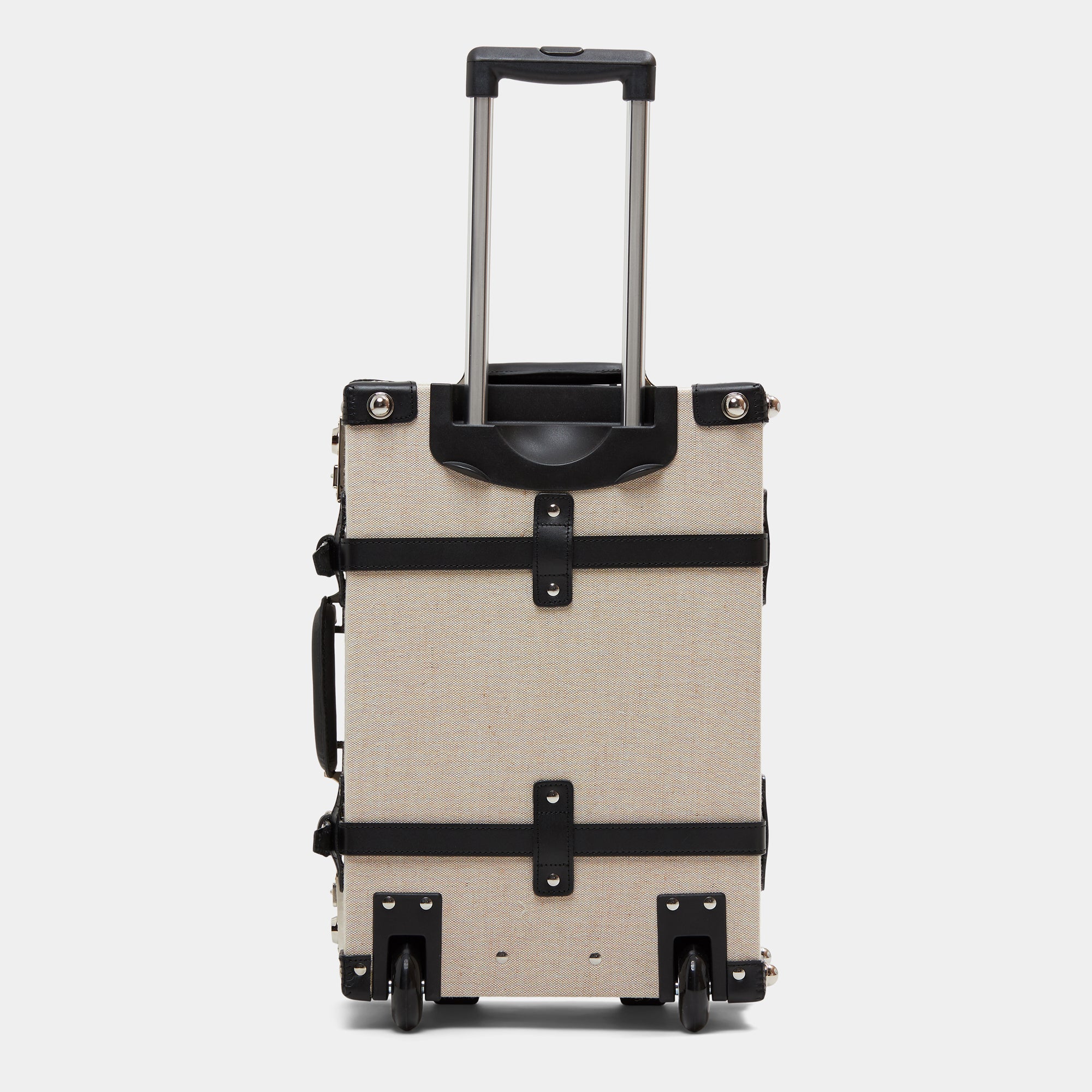 Beige suitcase with black accents on a white background