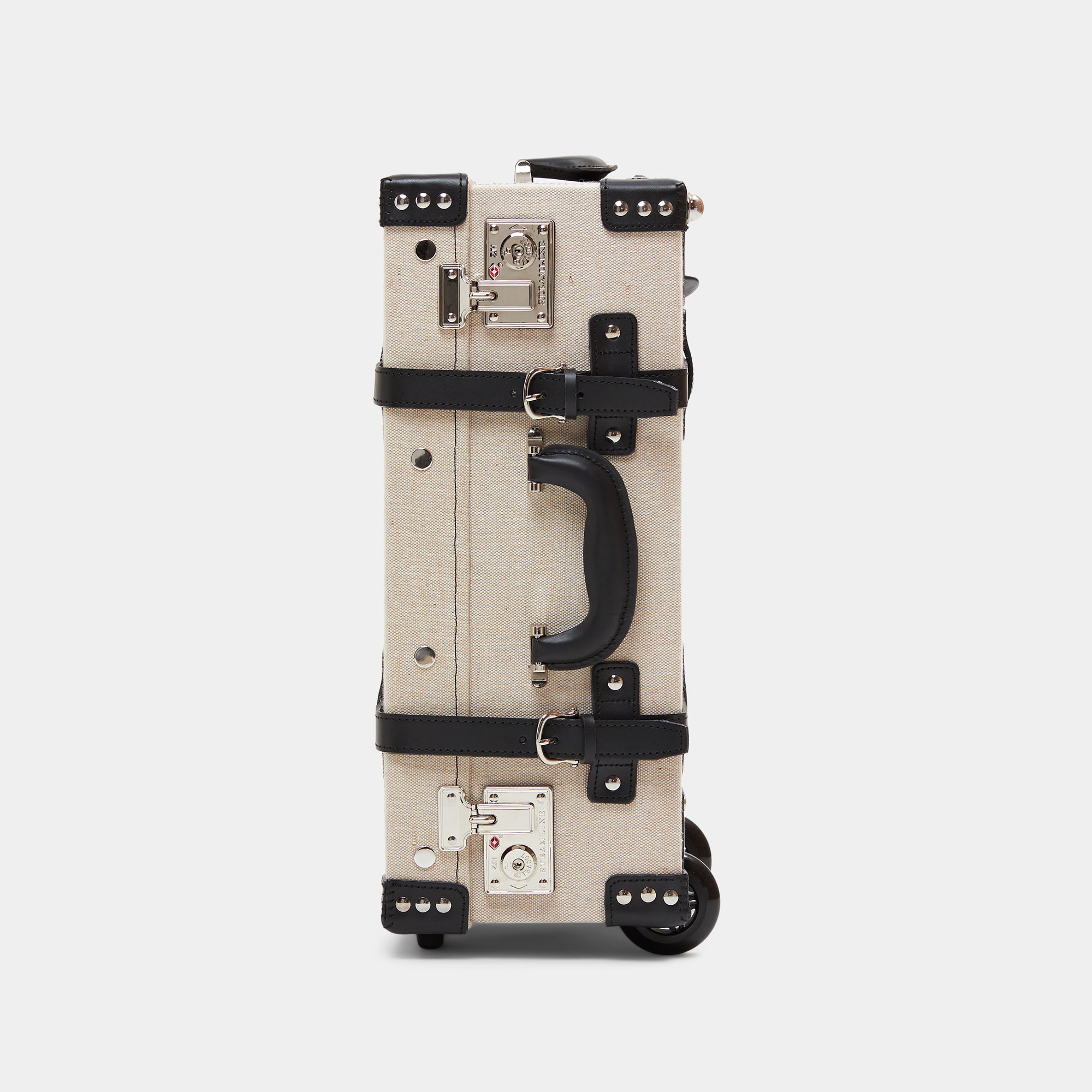 Beige suitcase with black accents on a light gray background