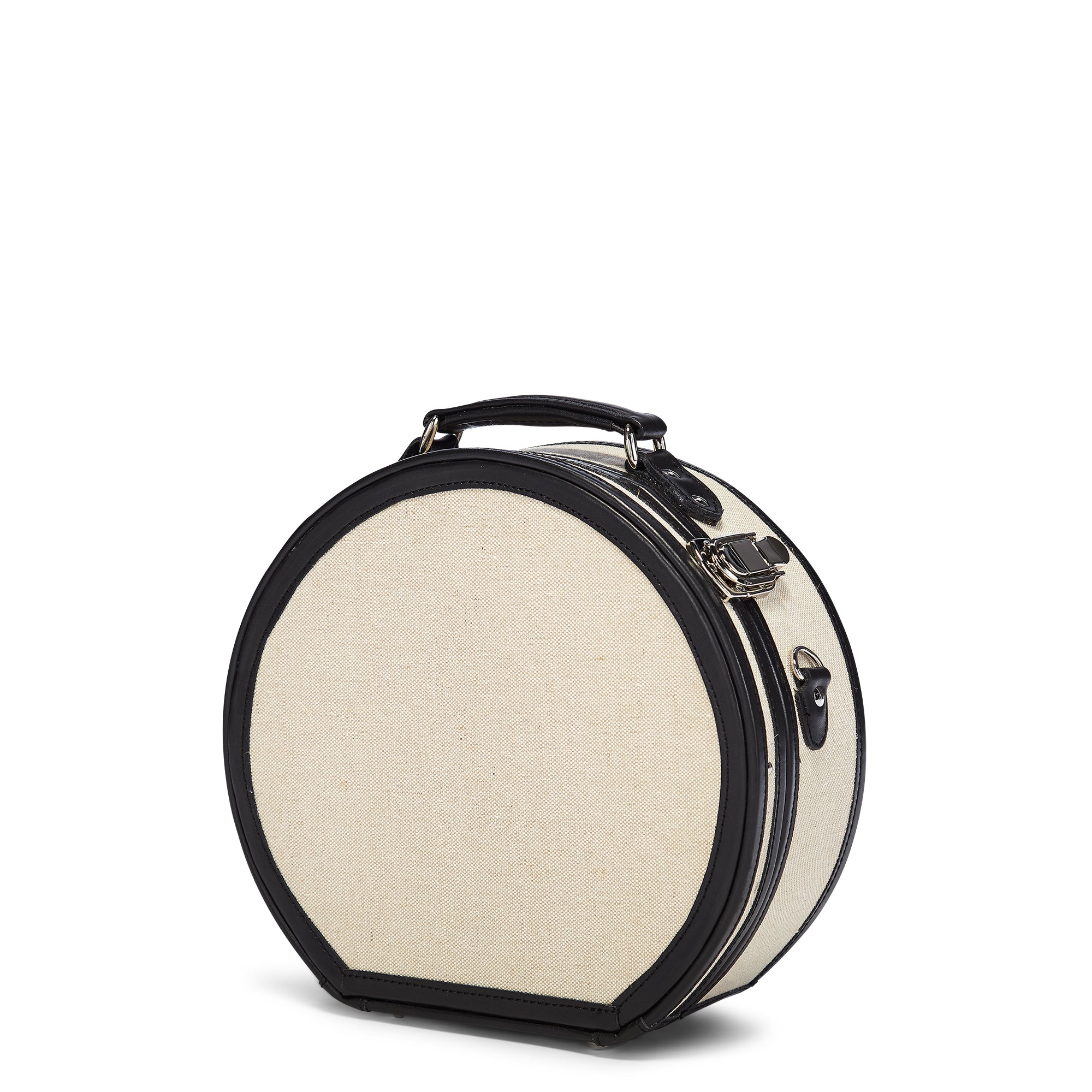 Round beige travel case with black trim on a white background