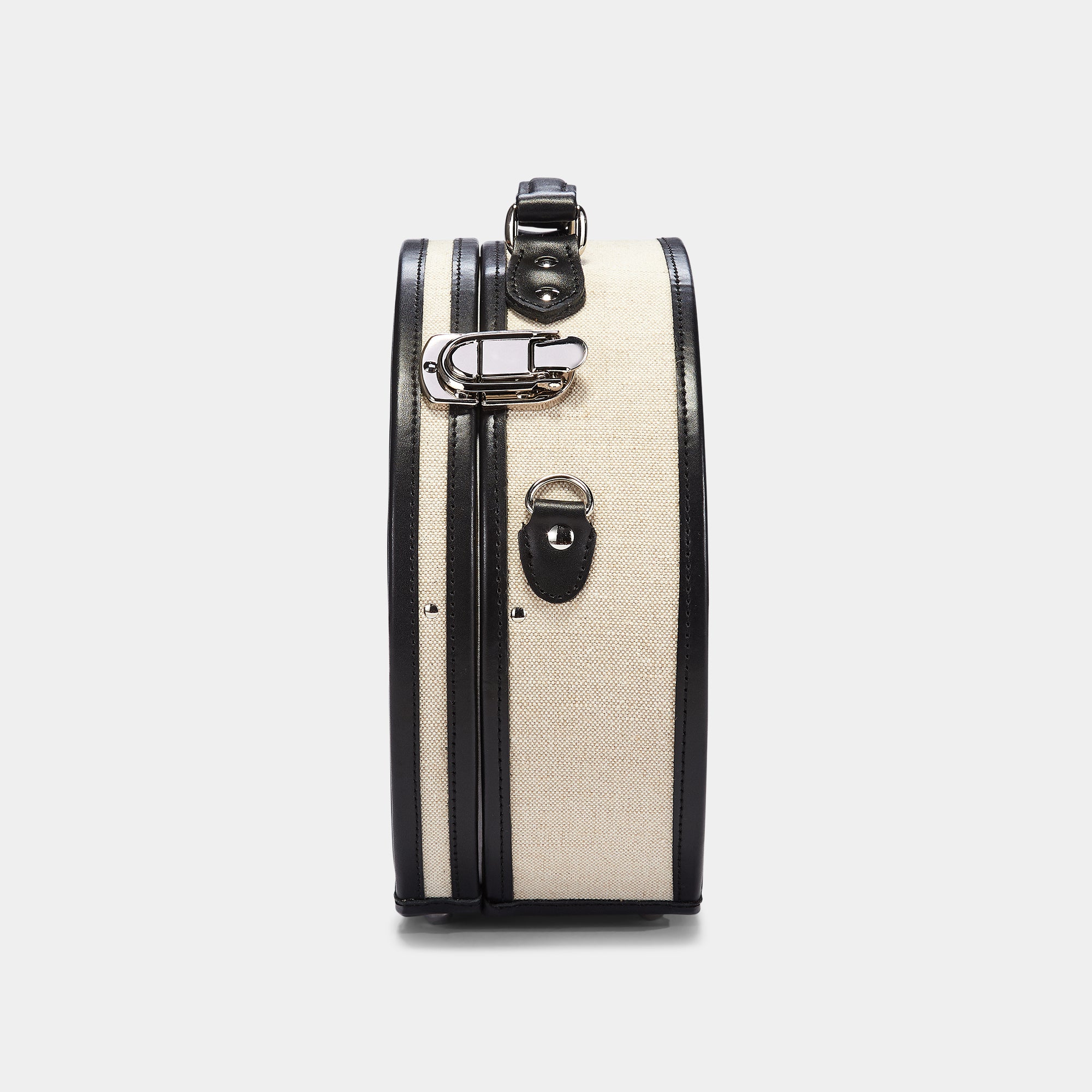 Small suitcase with black trim on a white background