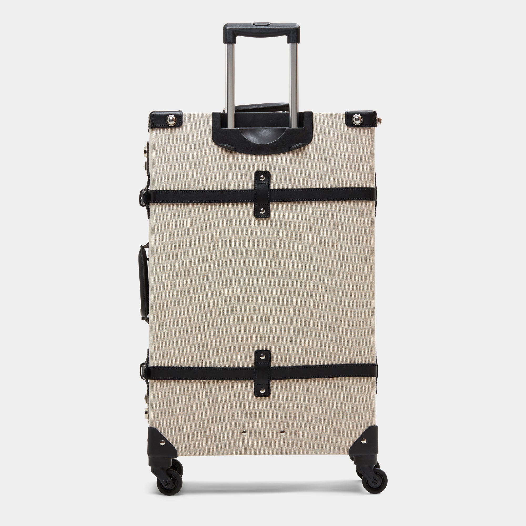 Beige suitcase with black straps on a white background