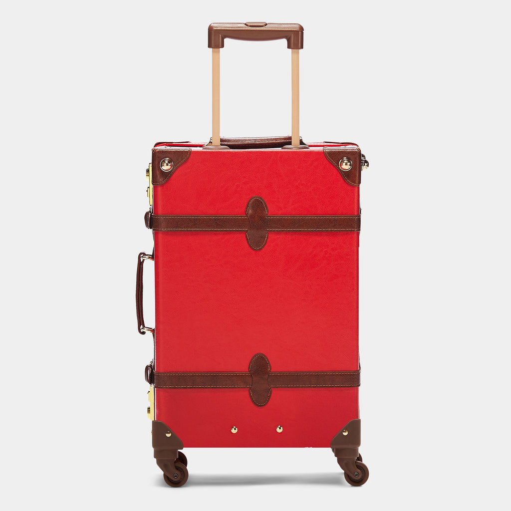 Red suitcase with brown accents on a light gray background