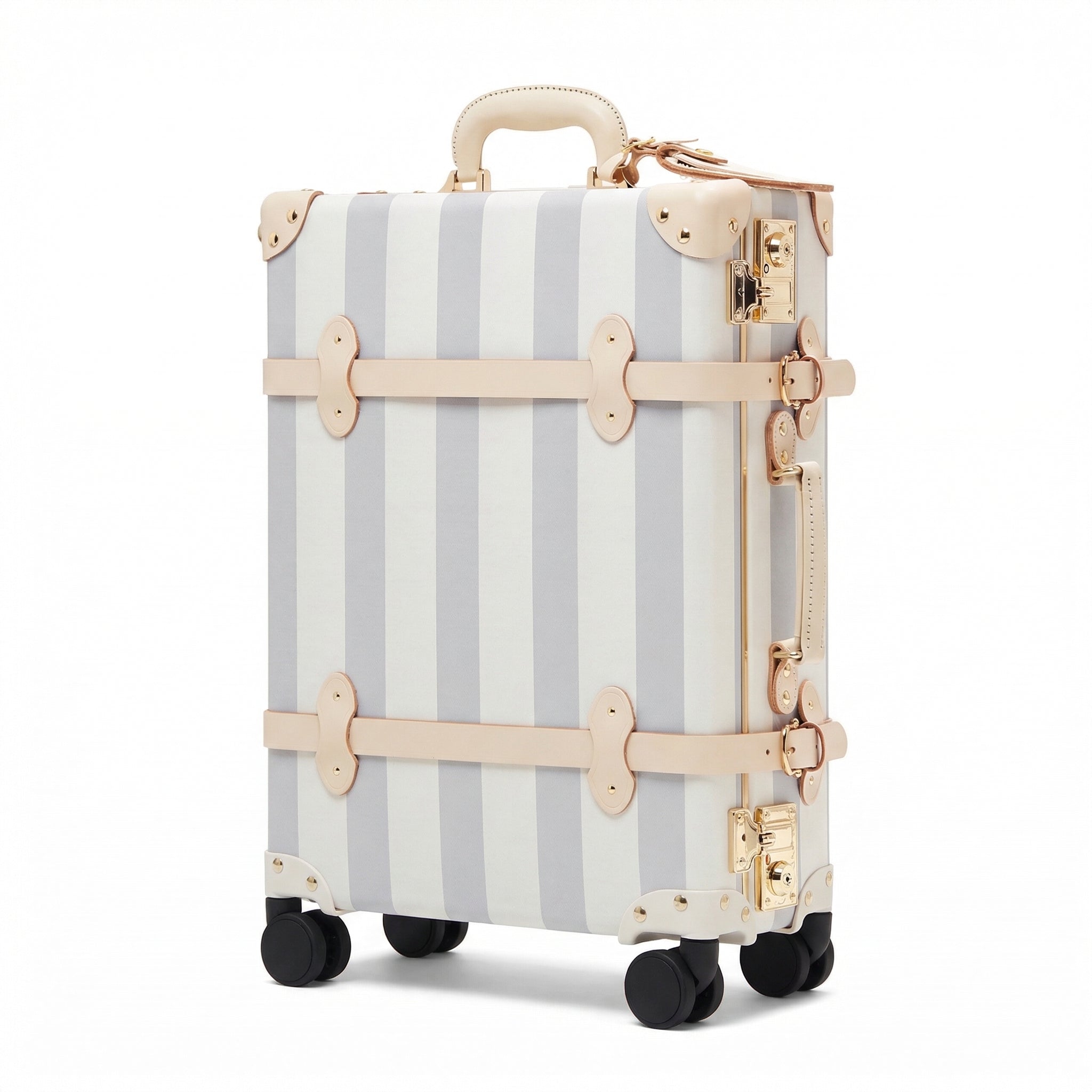 Striped suitcase with gold accents on a white background