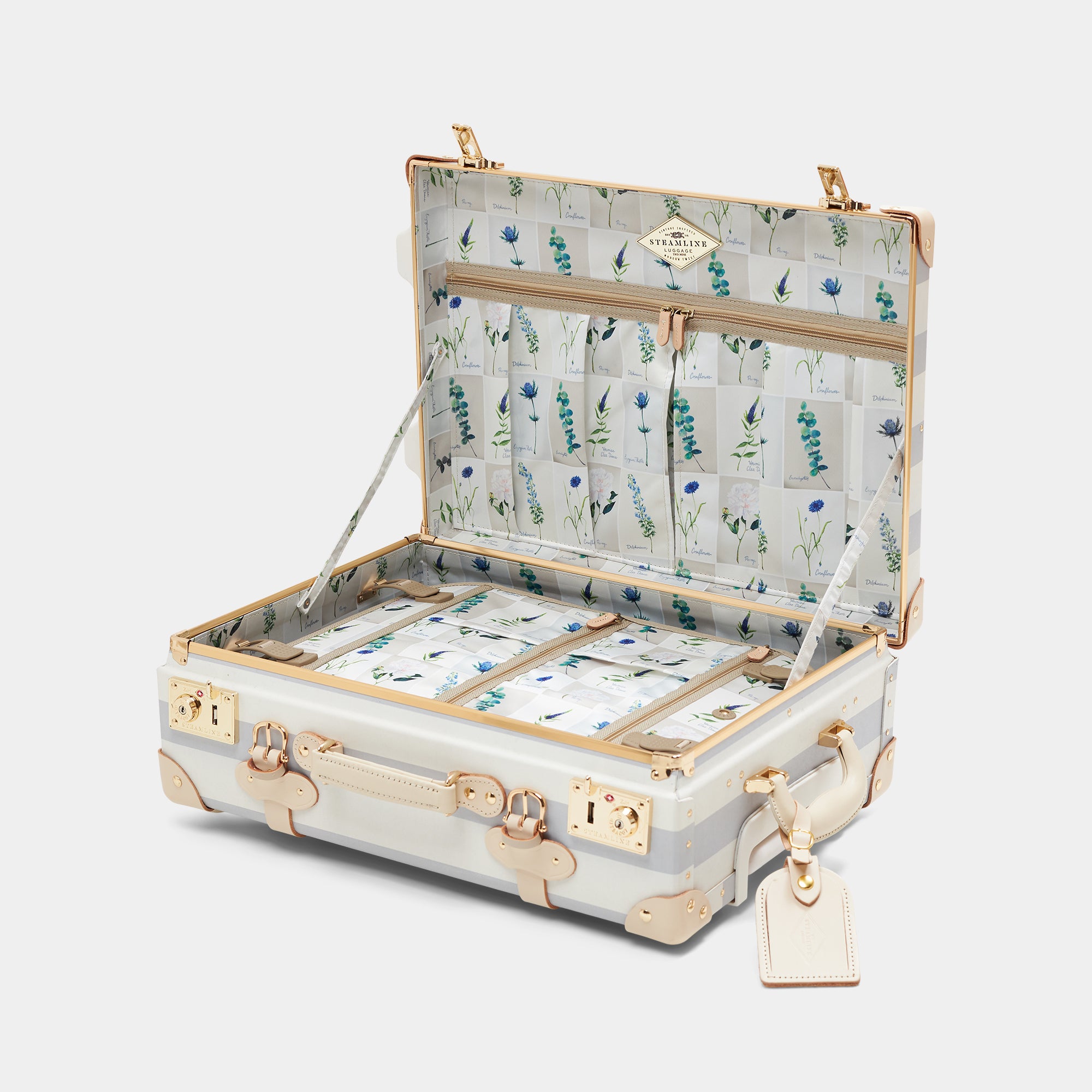 Open suitcase with floral interior on a white background