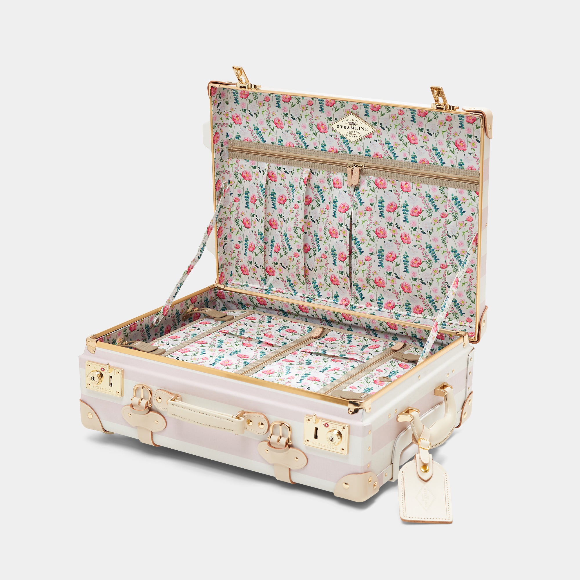 Floral-patterned suitcase with gold accents on a white background