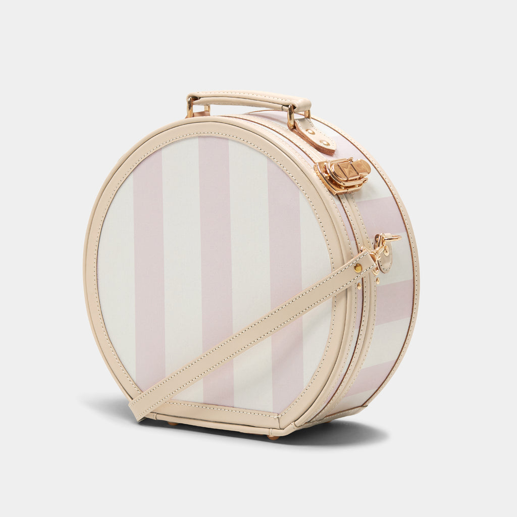 Heart-shaped makeup case with striped design on a white background