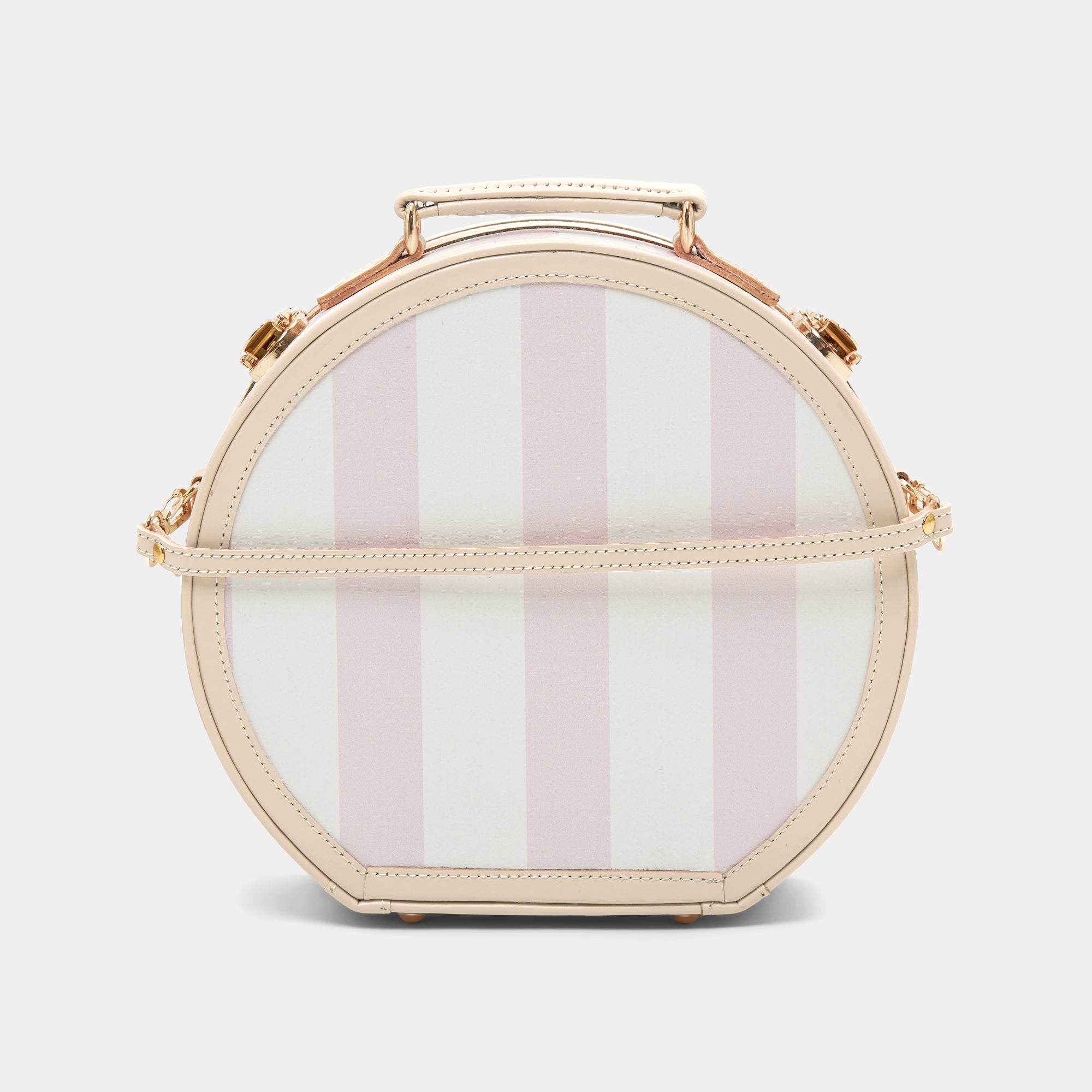 Round handbag with pink and white striped pattern on a light gray background