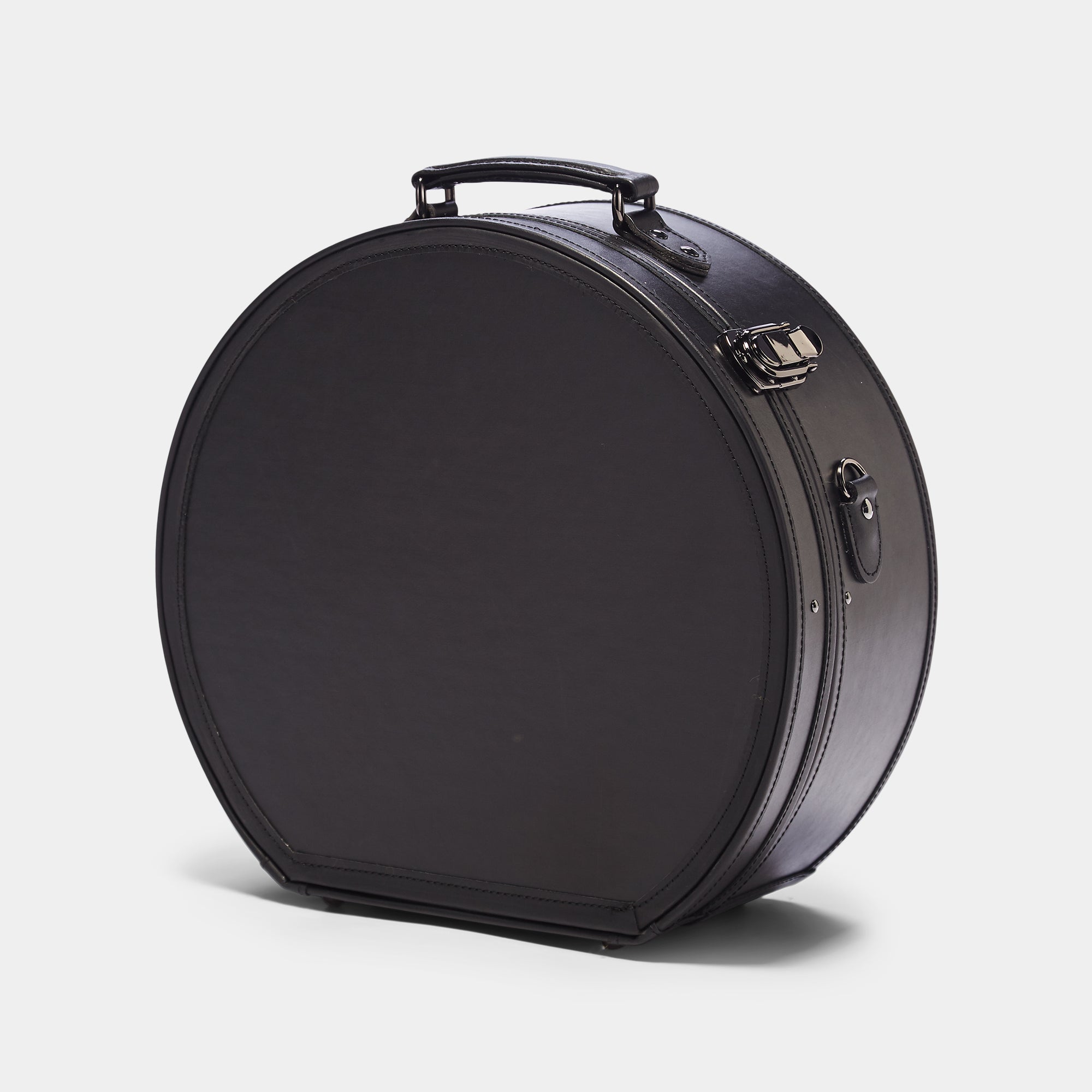 Black suitcase on a light gray background