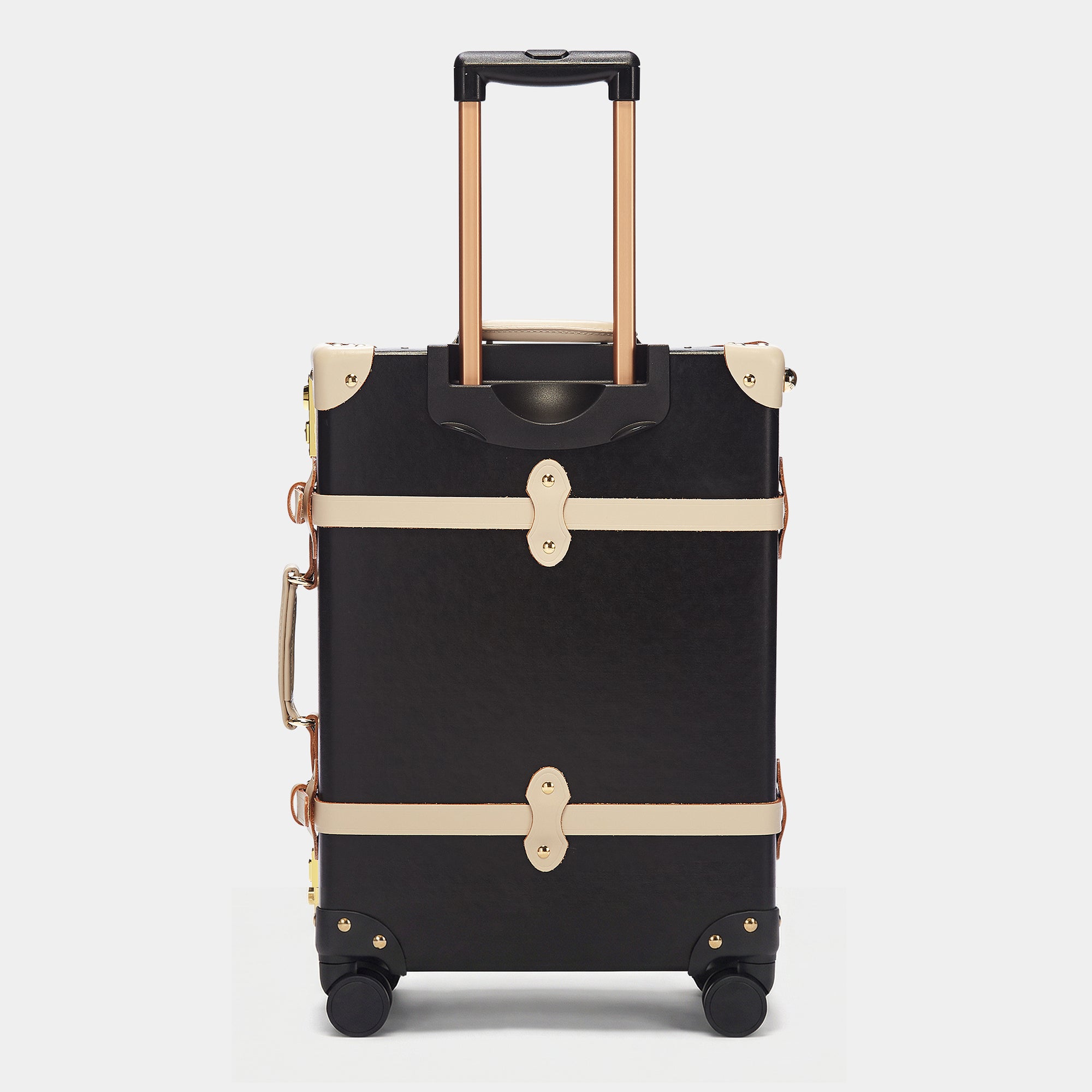 Black suitcase with gold accents on a white background