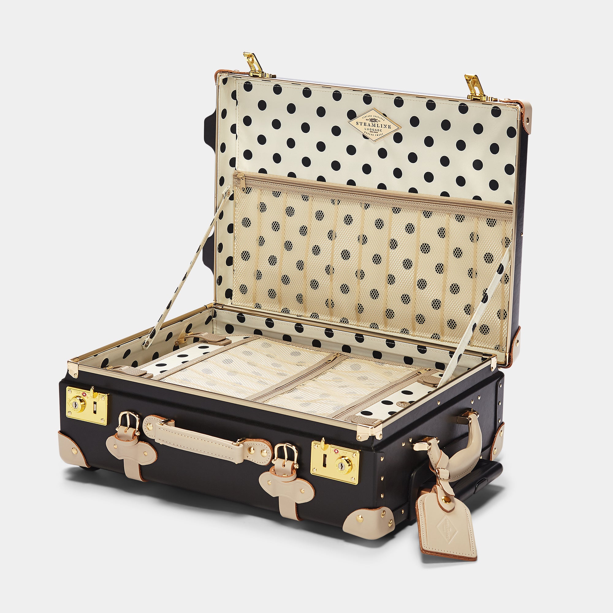 Polka dot suitcase with open lid on a white background