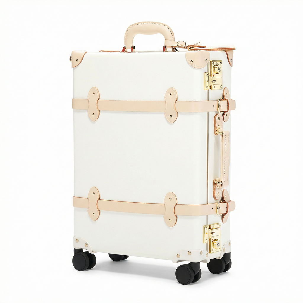White suitcase with gold accents on a white background