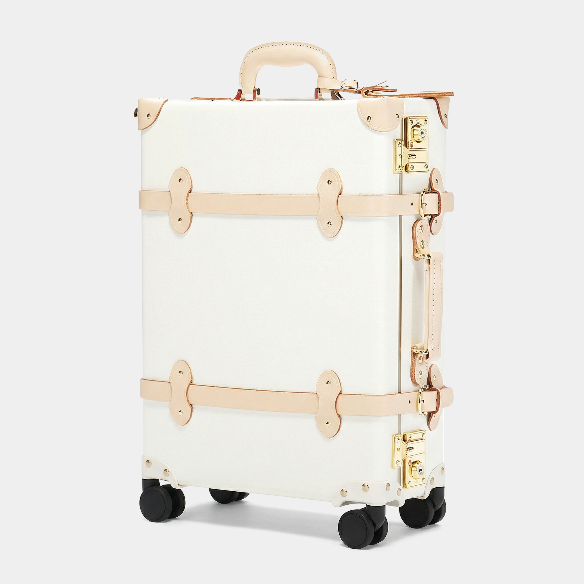 White suitcase with gold accents on a white background