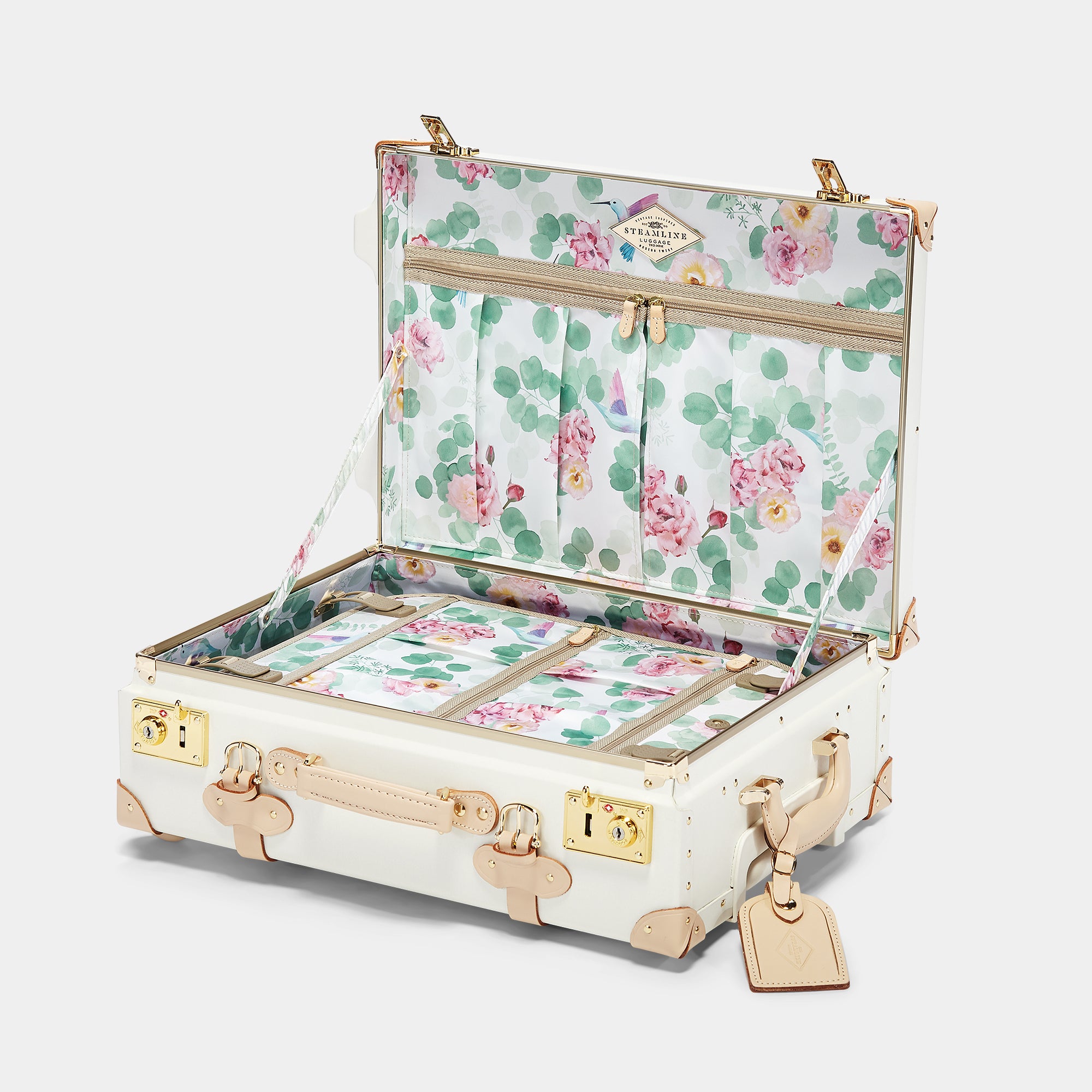 Floral-patterned suitcase with gold accents on a white background
