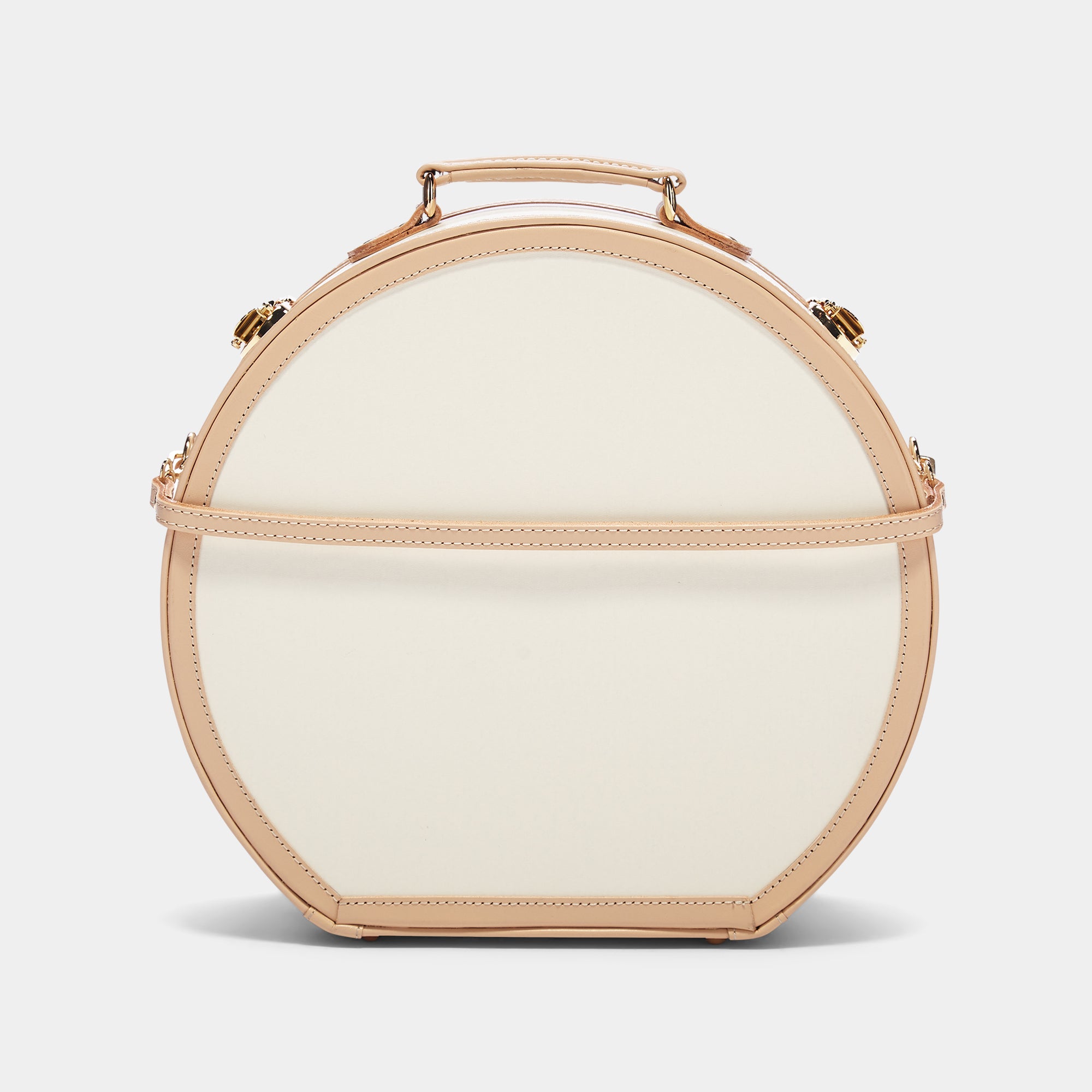 Round beige handbag with gold accents on a light gray background