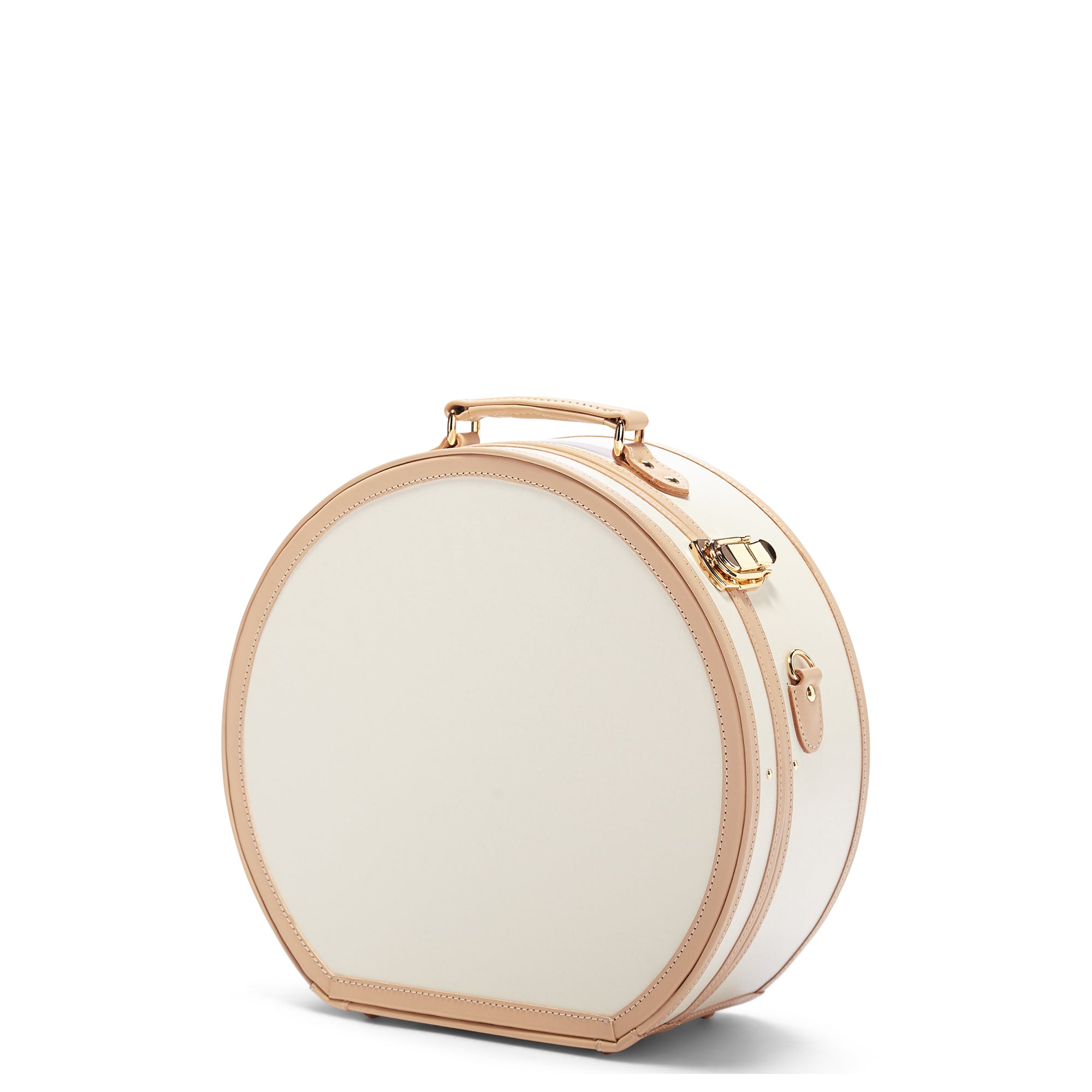 Round white beauty case with gold accents on a white background