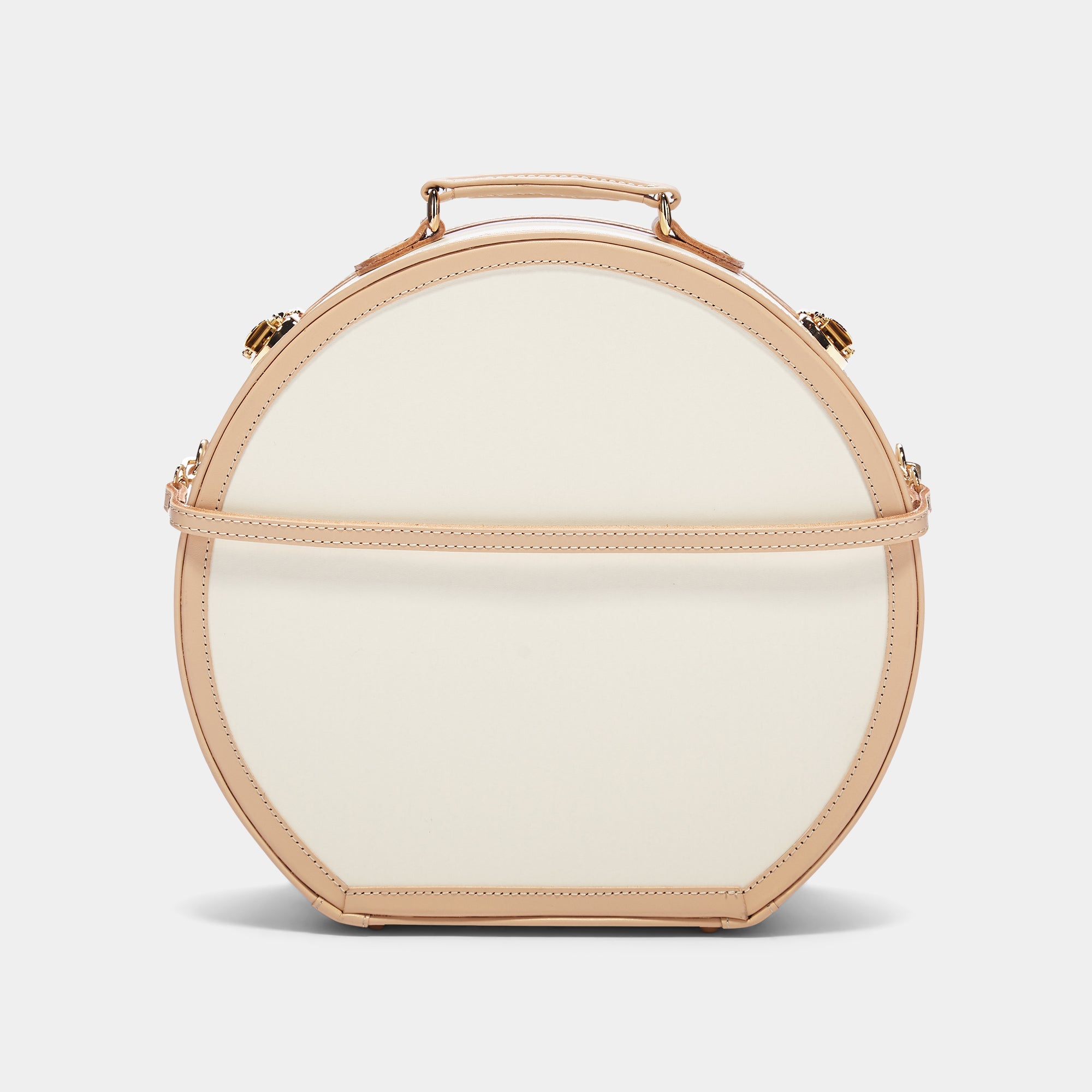 Round beige handbag with gold accents on a light gray background