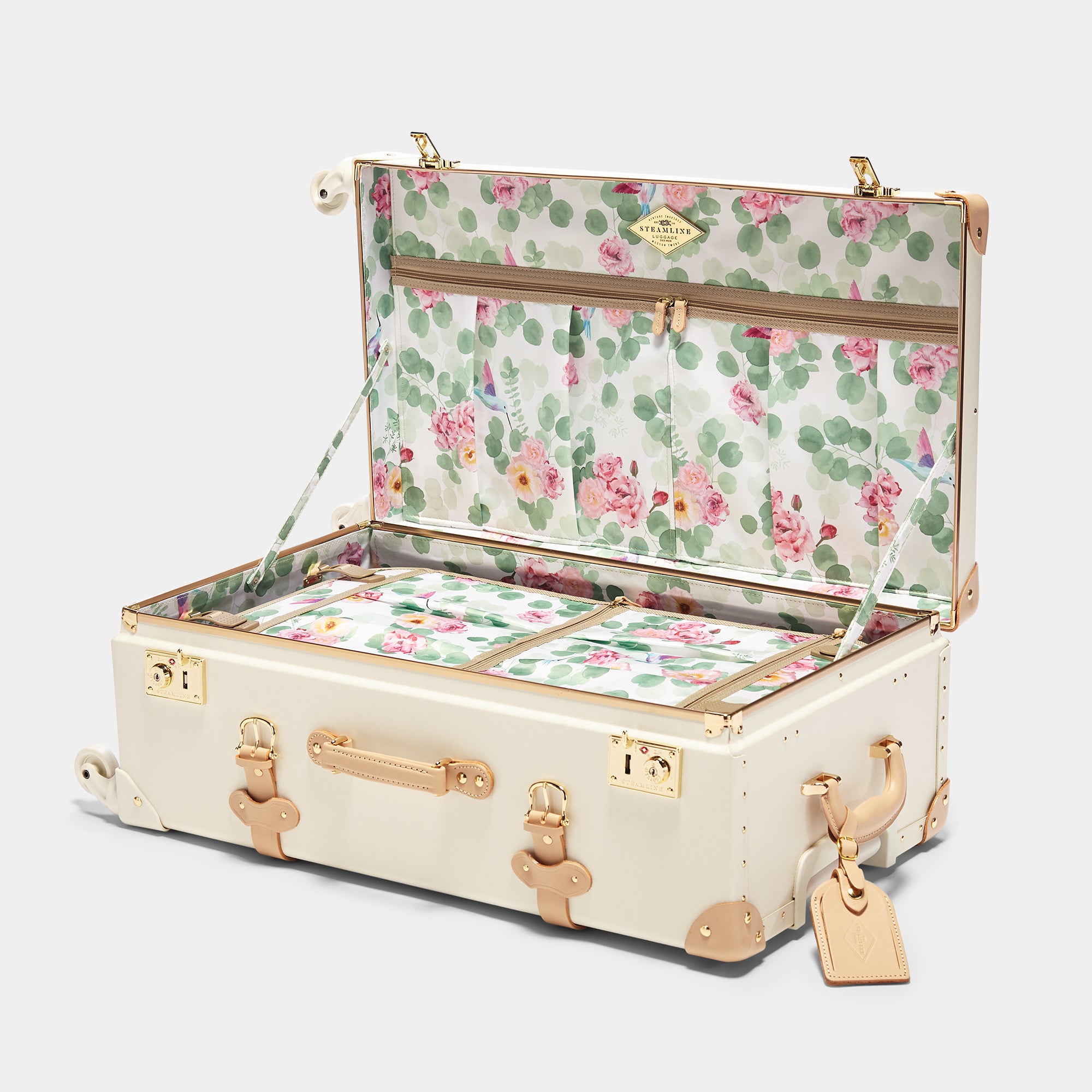 Floral-patterned suitcase with gold accents on a white background