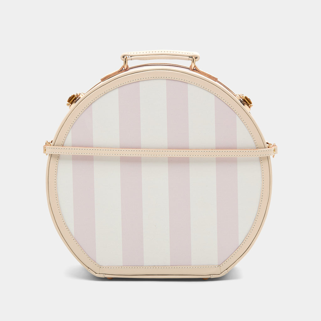 Round striped bag with a gold handle on a white background