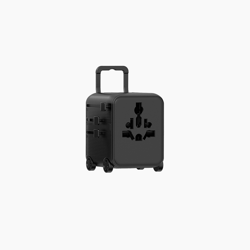 The Luggie Black suitcase worldwide power adapter with a brand logo on a white background