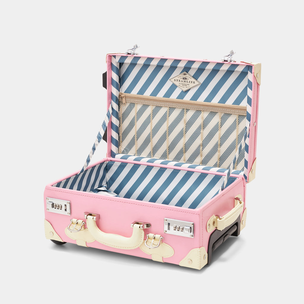 Pink suitcase with blue and white striped interior on a light gray background
