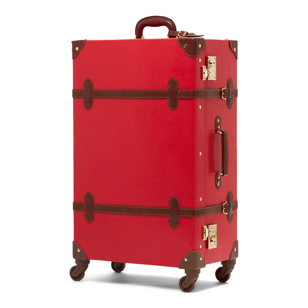 Red suitcase with brown accents on a white background
